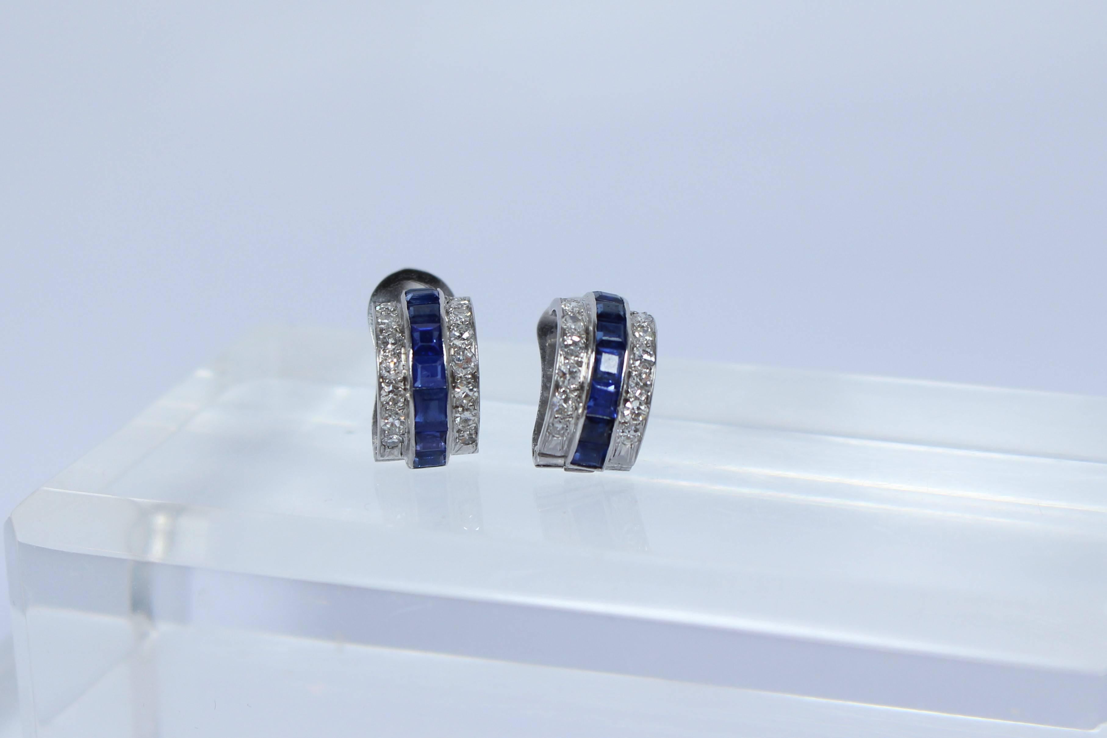 These earrings are composed of 14KT with sapphires and diamonds. There is a tension back with post. In excellent vintage condition.

Specs: 
14KT White Gold
16 - Blue Emerald Cut Sapphires Approximately 0.08 Carats 
28 - Single Cut Diamonds