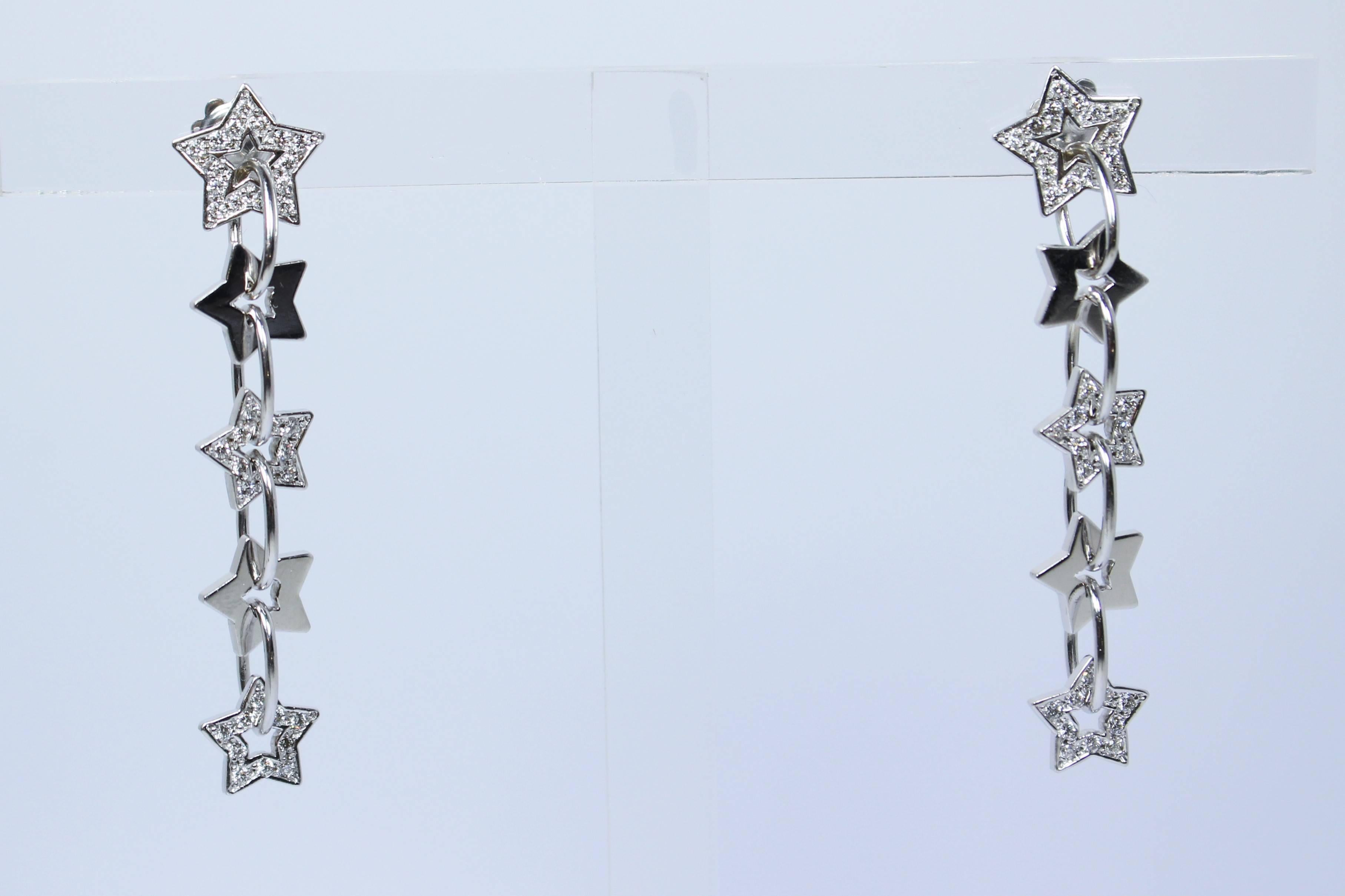 These earrings are composed of 14KT pave white gold with a star design. Features a post back. In excellent vintage condition.

Specs: 
14KT White Gold
Approximate 70 diamonds 0.70 Carats

Length: 2