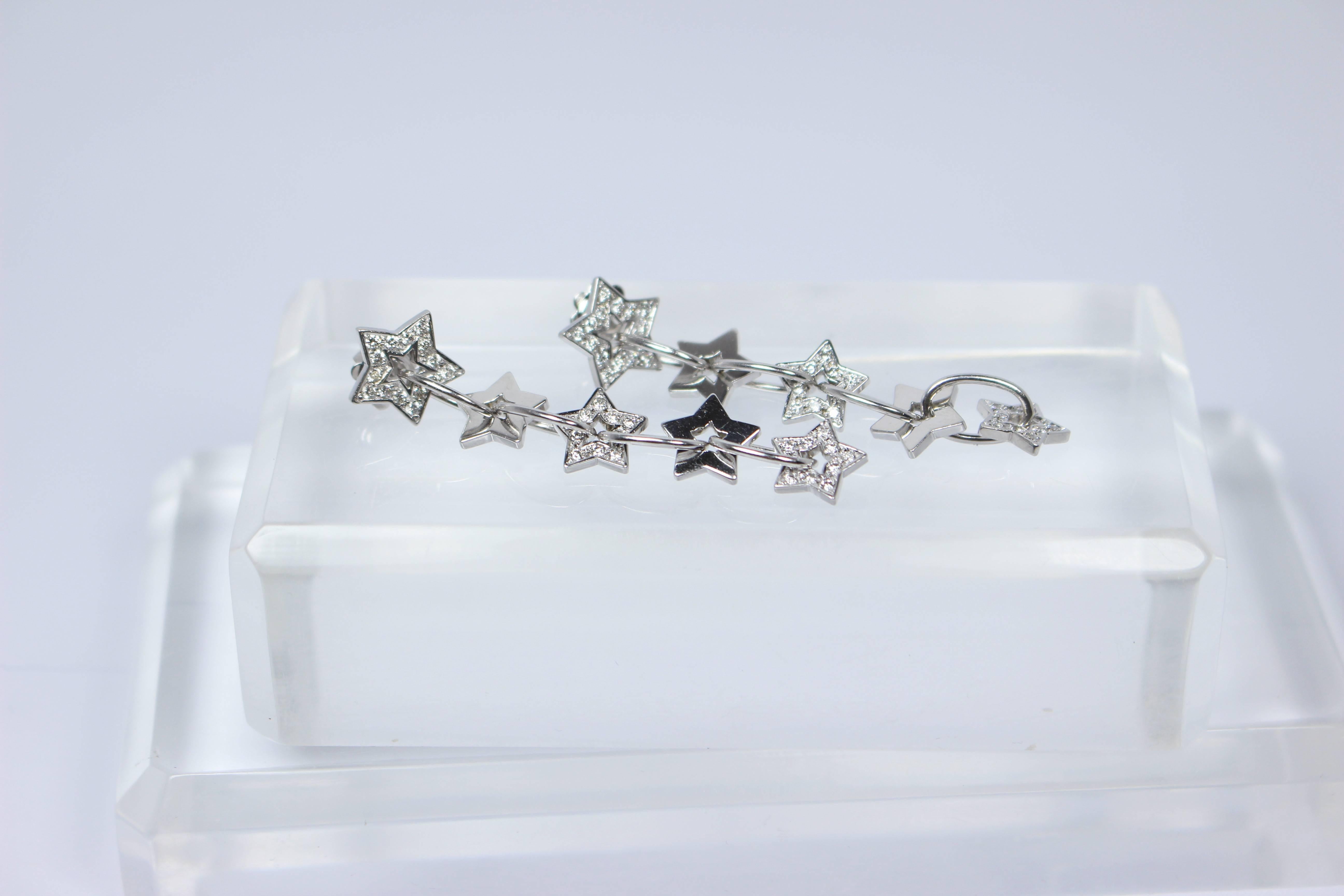 Women's Pave Diamond Gold Dangle Star Earrings  For Sale