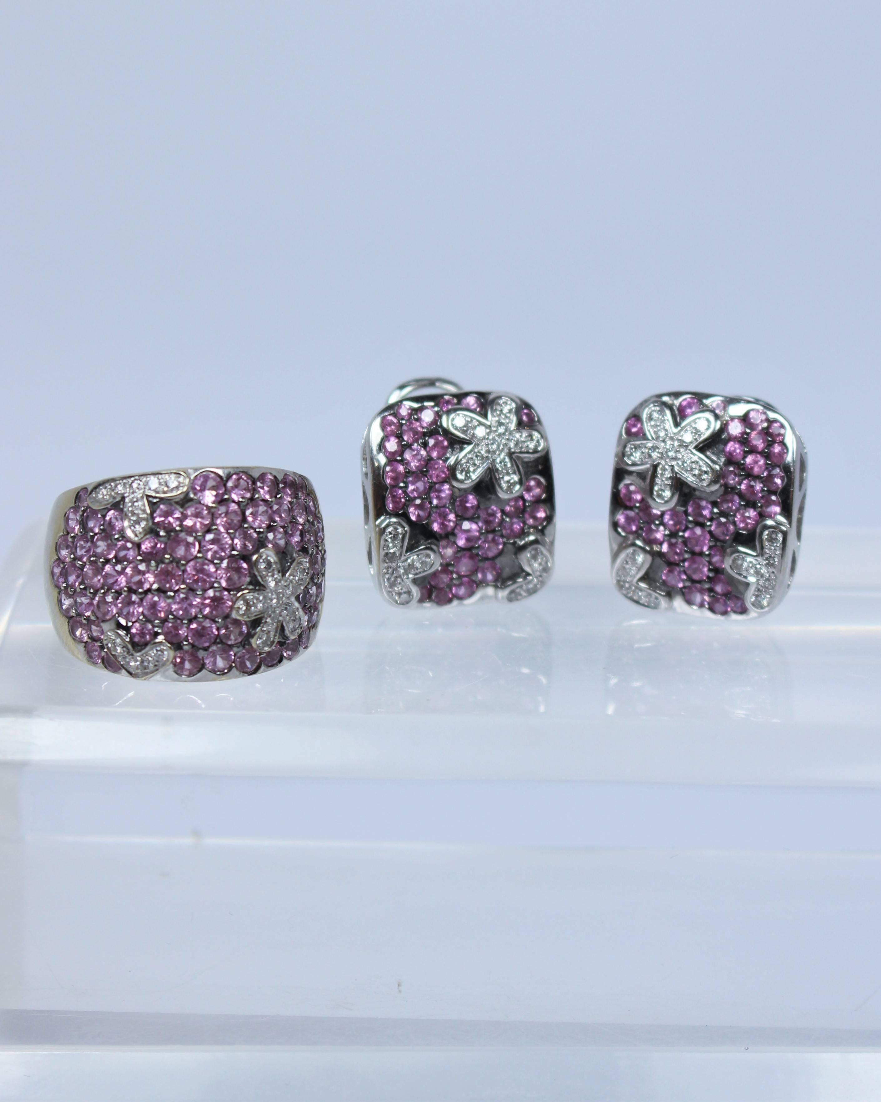 This set is composed of 18KT white gold, pink tourmaline, and white diamonds. The earrings feature a post backing with tension clasp. Ring is size 7. In excellent vintage condition.

Specs: 
14KT White Gold
Pink Tourmaline
White