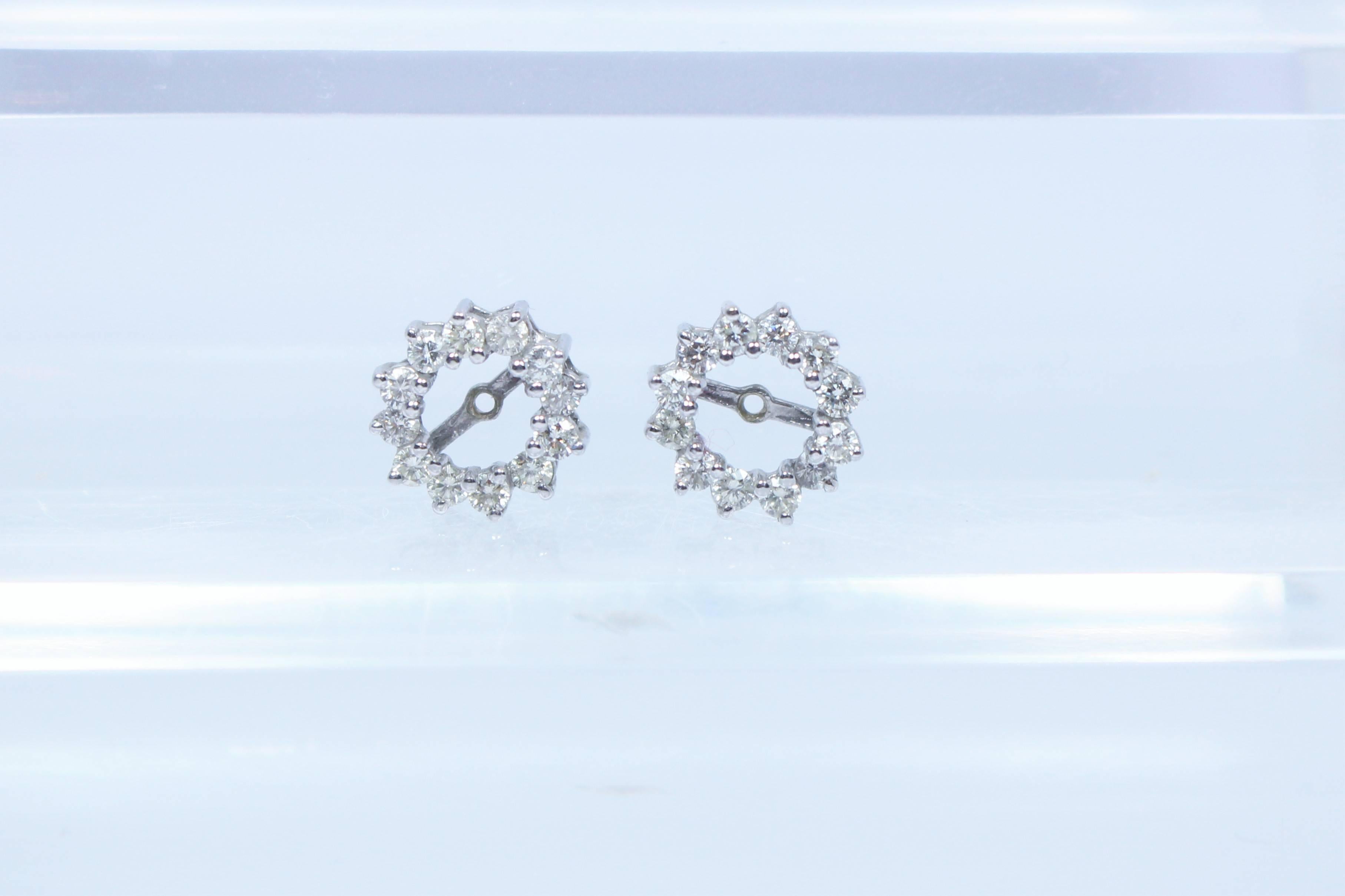 These earrings are composed of 14KT white gold with round diamonds, approximately 12 at .05 carats each. A perfect accent to a classic stud. 
The jackets and they will accommodate UP TO  a .65 carat diamond stud.
The jackets could also easy be worn