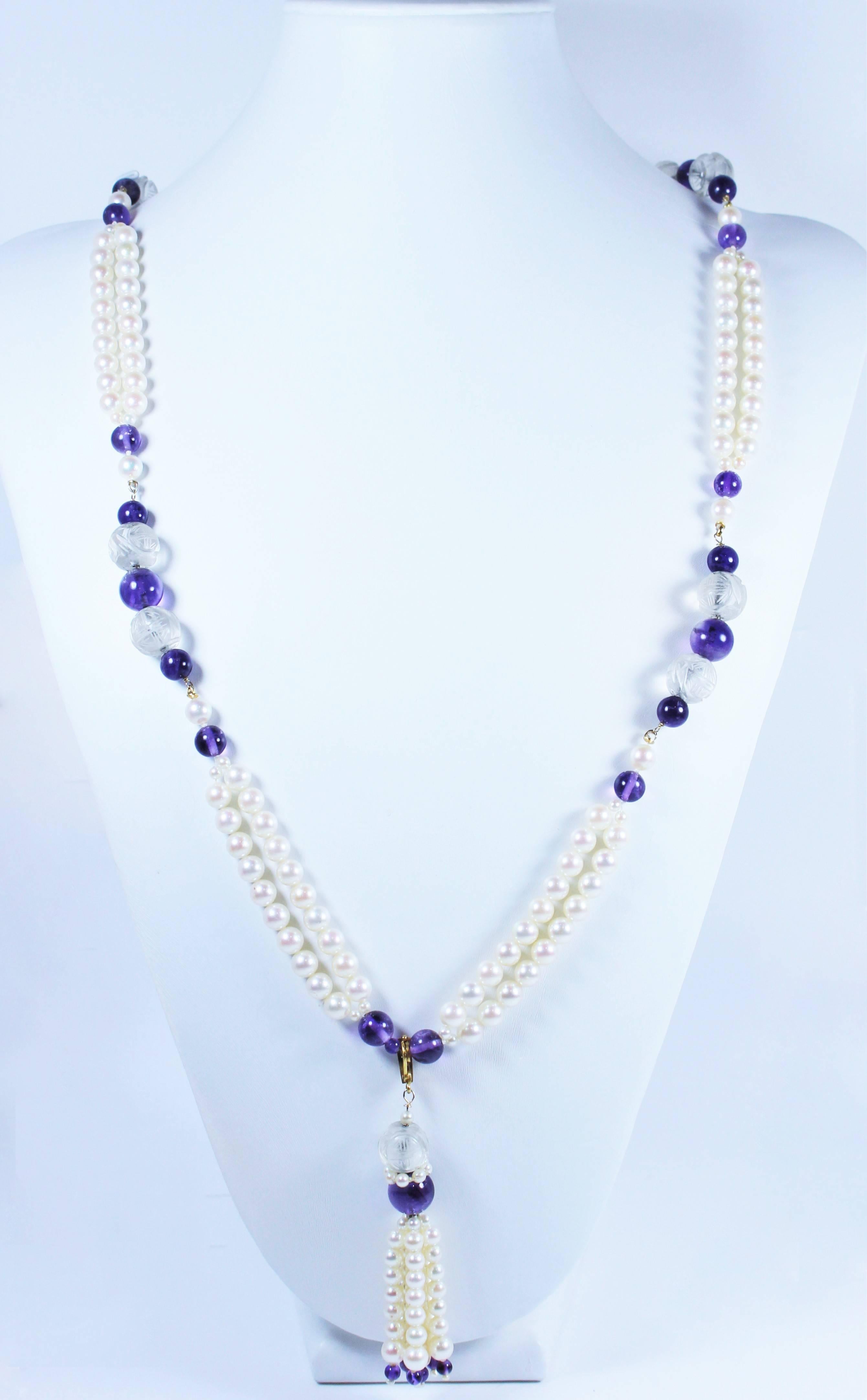 This necklace is composed of pearls with cut crystal, Amethyst, and 18KT gold. Features a removable tassel. In excellent vintage condition.

Specs: 
18KT Yellow Gold
Length: 38