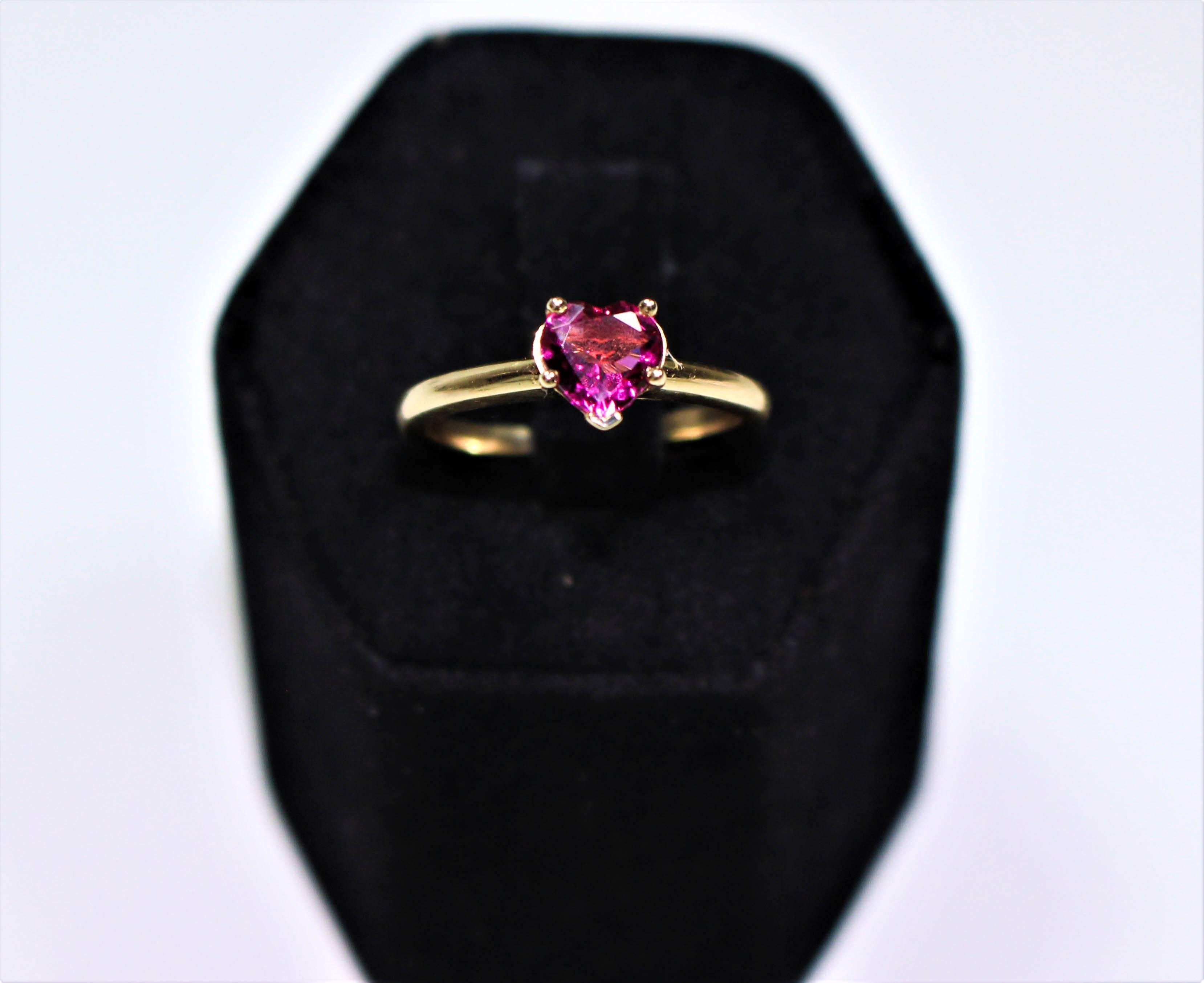This ring is composed of 14KT yellow gold with a heart cut pink tourmaline .71 ct.
 A beautiful and classic style that is the perfect gift. 
RING Size 5.5 which is easily sizable.

Please feel free to ask any questions you may have, we are happy to