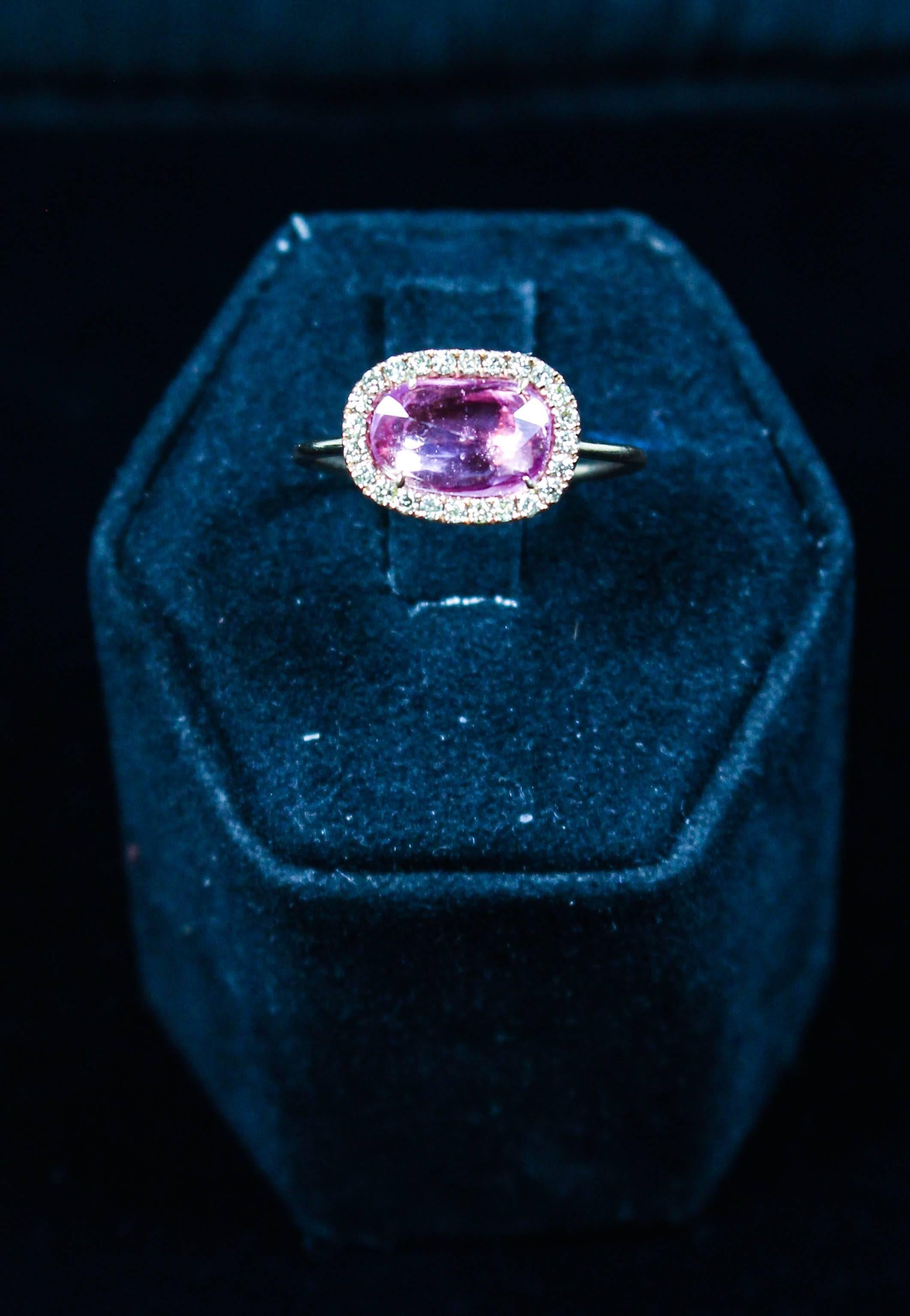 This beautiful ring features a stunning pink sapphire center stone and is composed of 18kt rose gold. There are pave diamonds which accent the center stone. Specs below. In excellent condition.

Please feel free to ask any questions you may have, we