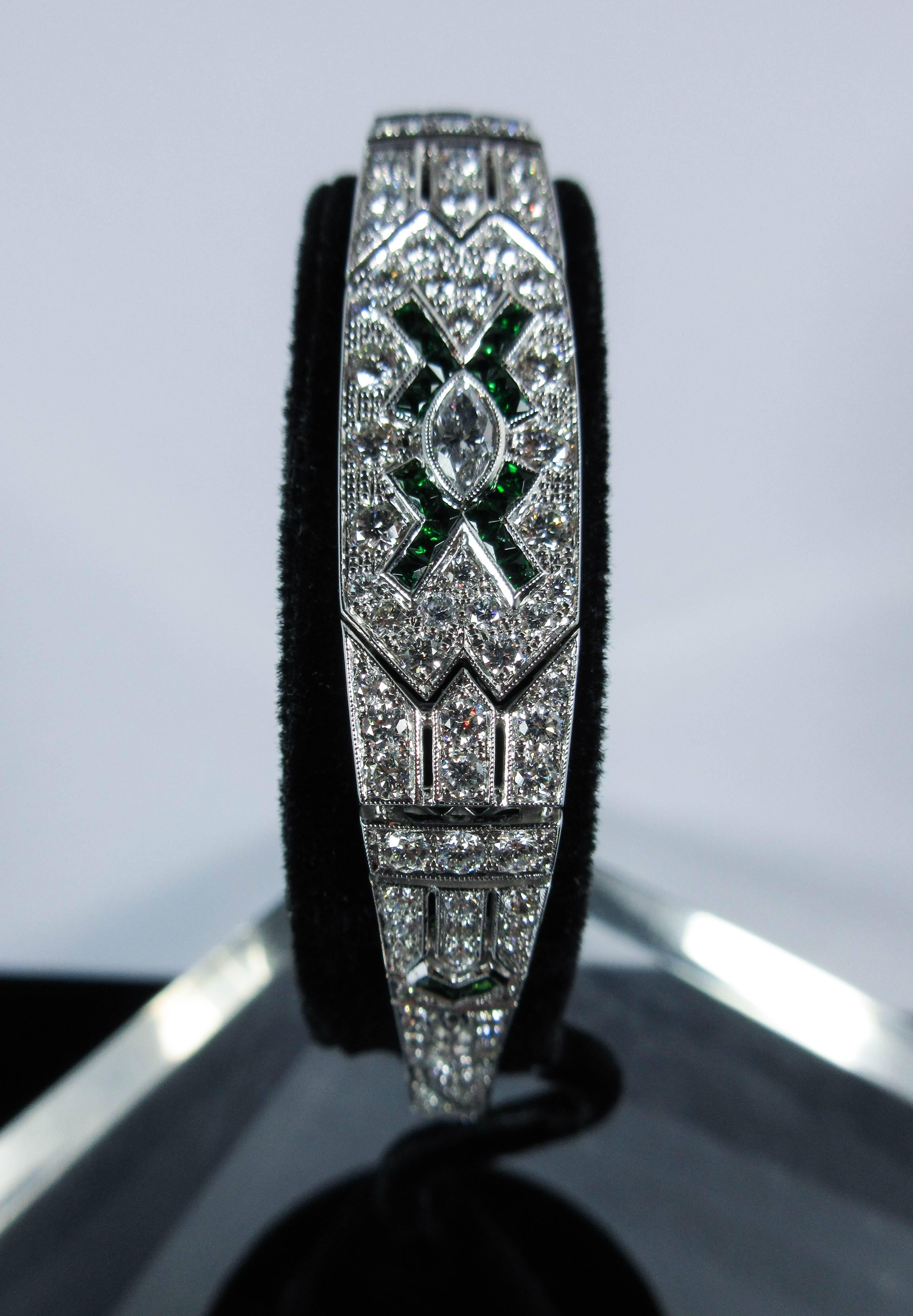 Tsavorite Garnet and 4.55 Carat White Diamond White Gold Bracelet.
This Deco style bracelet is composed of white diamonds and green Tsavorite Garnets. 

Please feel free to ask any questions you may have and it will be our pleasure to assist you