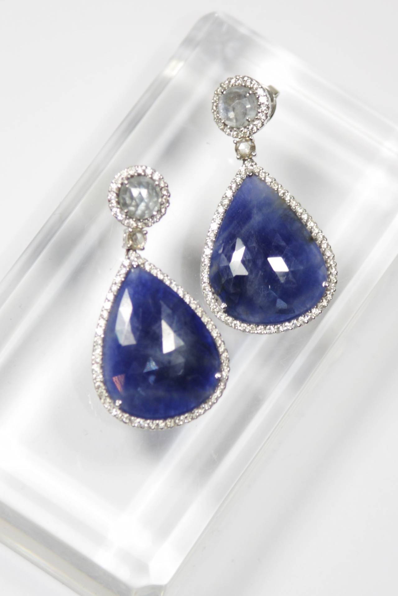 These 18kt White Gold, Diamond, and Sapphire  earrings are available through The Paper Bag Princess of Beverly Hills. Please feel free to contact us with any inquiries you may have. We also consign.

Specs: 
18 KT White Gold 
Sapphire: 38.03