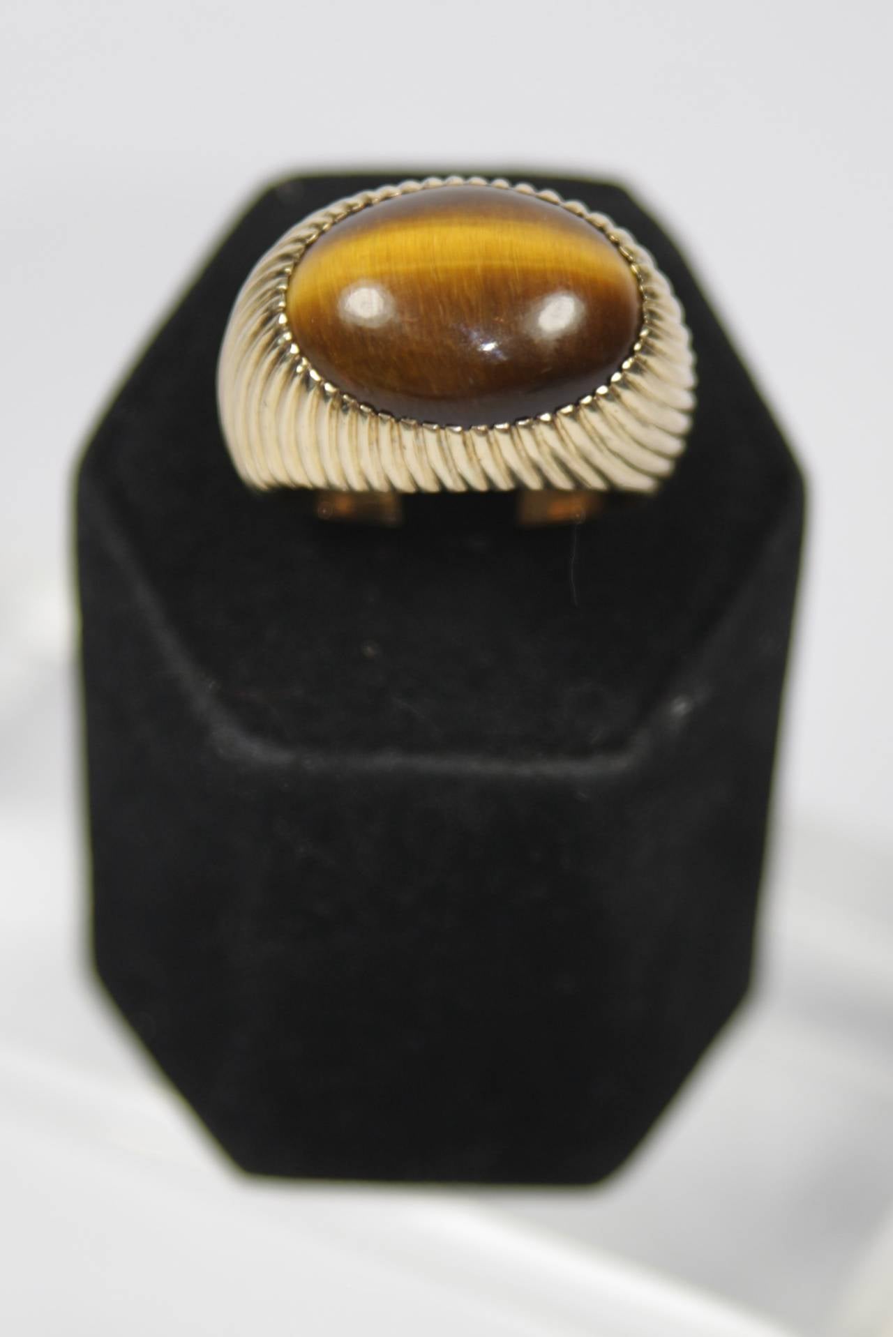 Specs: 
14 KT Gold Approximately 14.86 Grams
Tigers Eye Measures 1