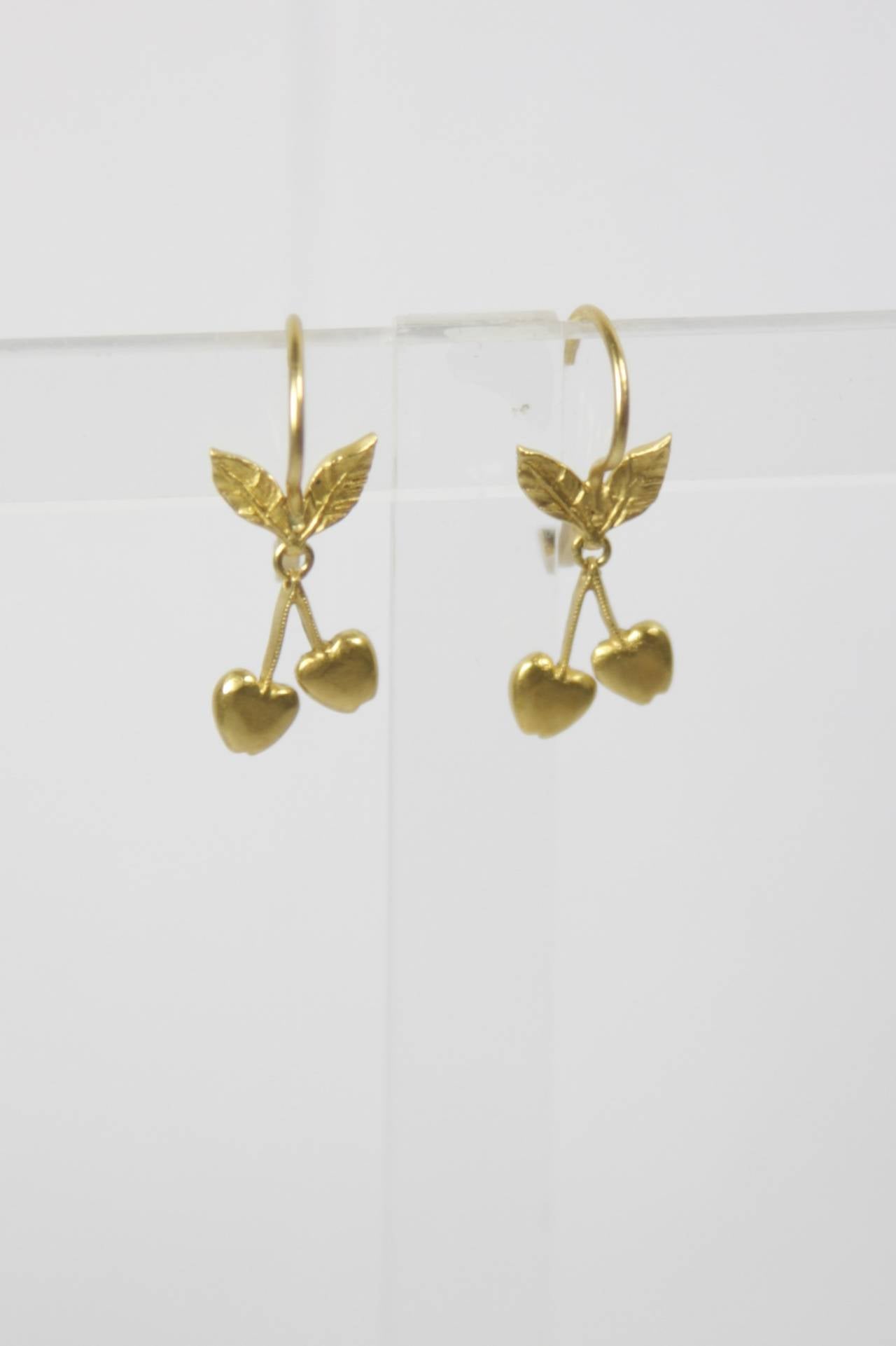 These Cathy Waterman earrings are available through The Paper Bag Princess of Beverly Hills. Please feel free to contact us with any inquiries you may have. 

They are composed of 22KT Gold and feature a lovely cherry theme. Absolutely delicious