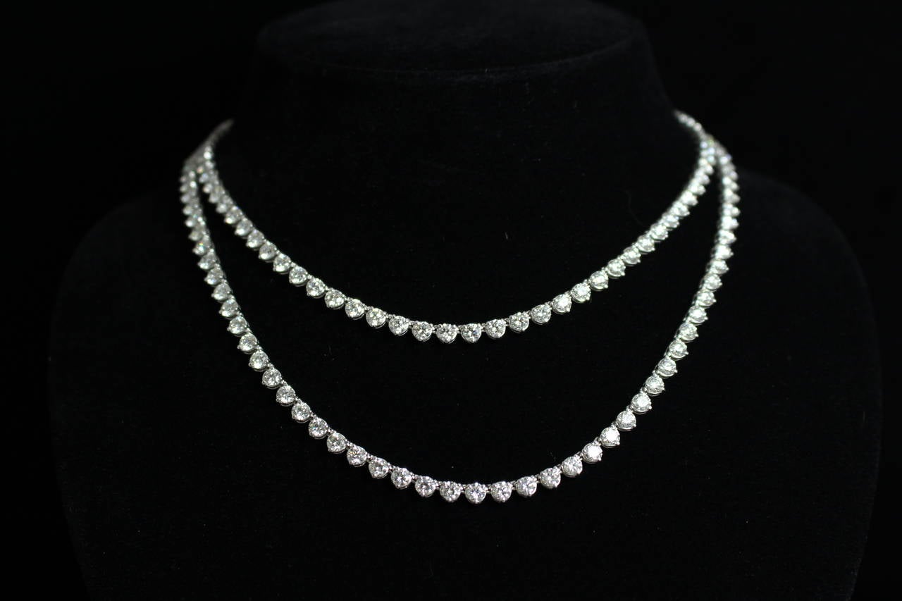 This is a lovely 18k white gold opera length necklace. This piece is set with 170 diamonds weighting approximately 33.50 carats total weight. This piece can be worn doubled or single. Looks stunning layered with other diamond necklaces as well.