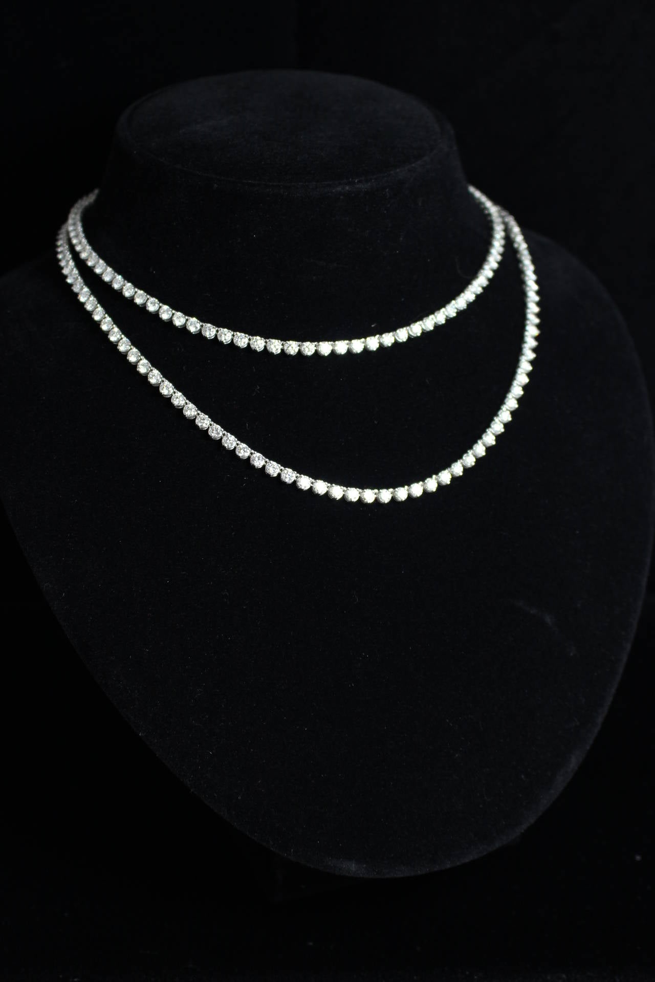 This is a stunning opera length diamond necklace. There are 196 round brilliant diamonds with an approximate weight of 25 carats. This piece can be worn double or single length. Looks stunning layered with other diamond necklaces as well.
