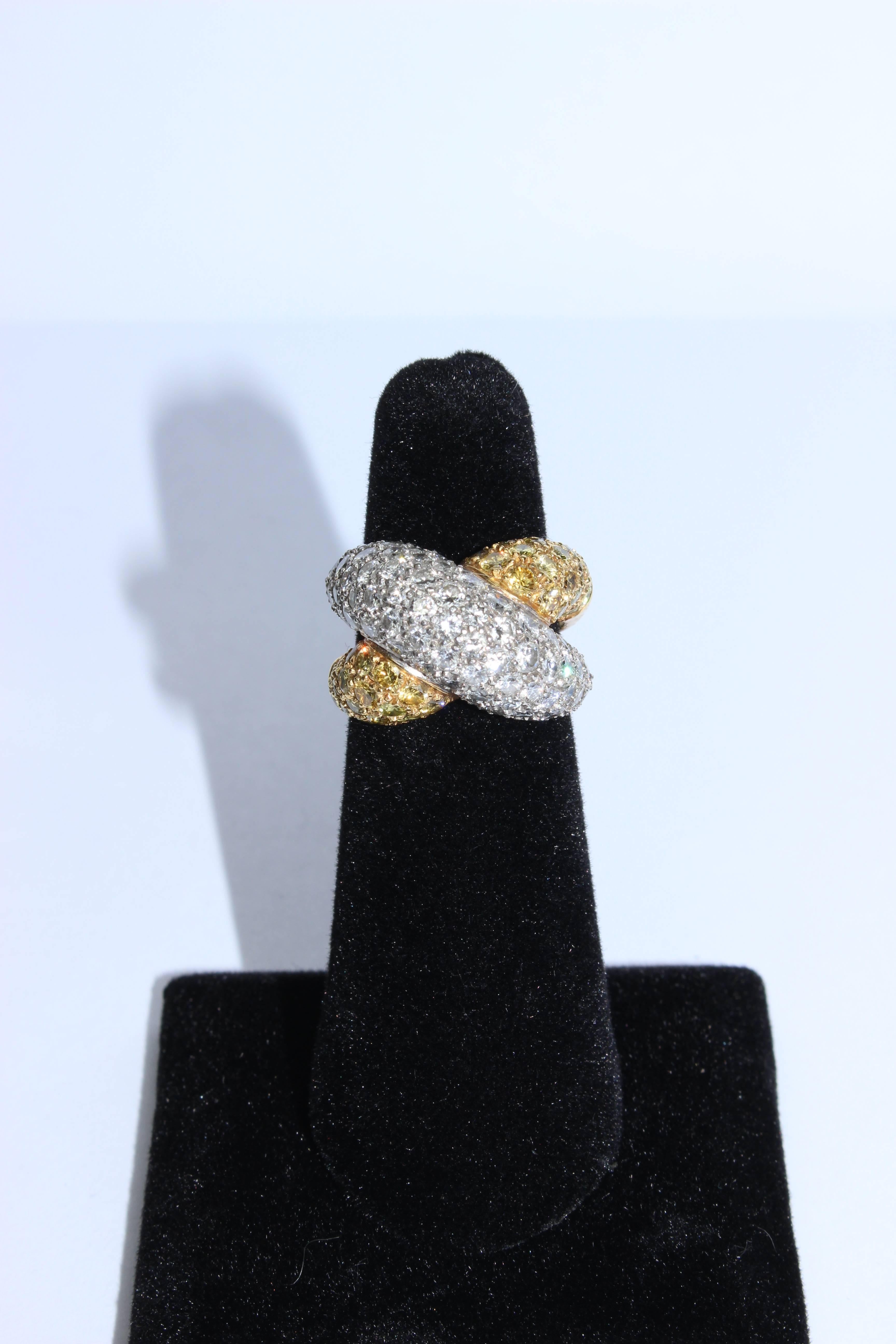 This 14KT pave ring is composed of 14KT yellow and white gold, which features yellow and white pave diamonds (.05mm) in a crisscross band design. An absolutely stunning design, in excellent vintage condition.

Specs: 
14KT Yellow & White