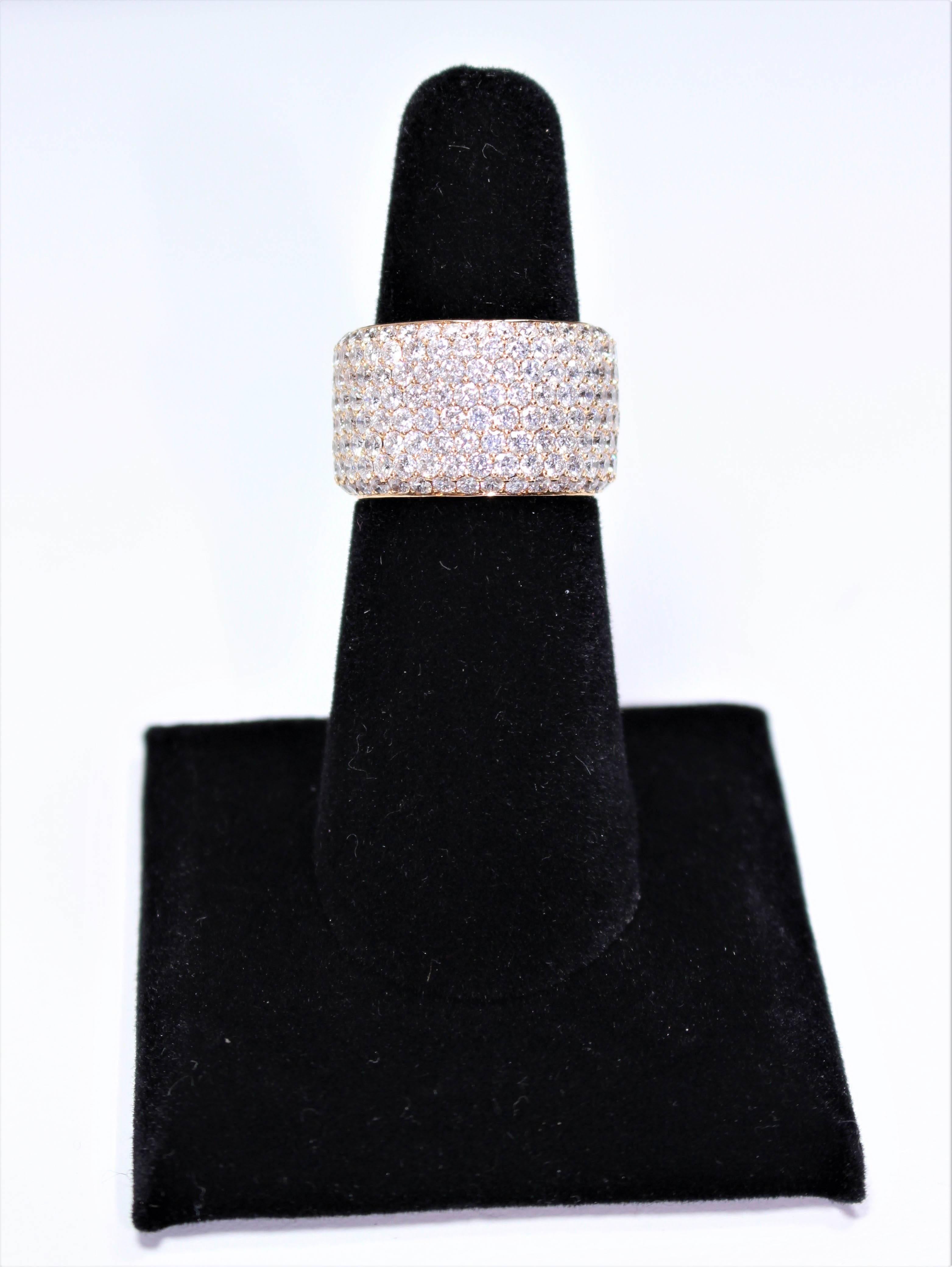 This ring is composed of a stunning 18 KT Rose gold featuring an eternity band design. Lavished with approximately 272 brilliant round cut pave diamonds boosting an approximate 7.59 Total Carat Weight (2.0mm and .03 carats each). Size 7, not