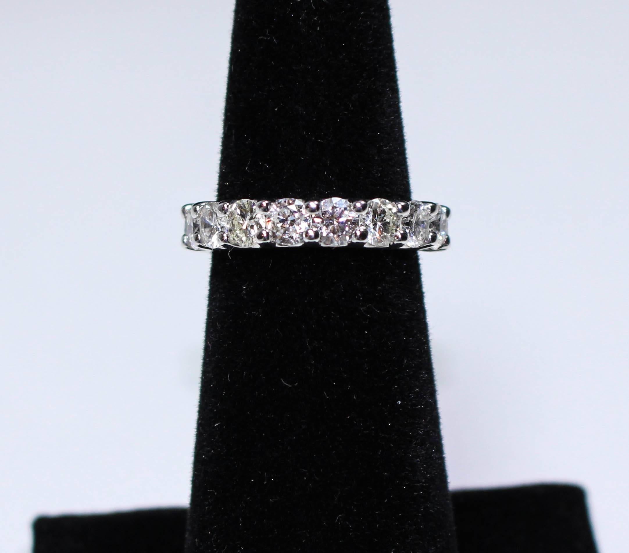This eternity band is composed of white gold with 17 stunning HS1 round cut diamonds with an approximate total weight of 4.04 Carats (each stone is approximately .20 carats and 3.8 mm in size). This ring is not sizable. 

Please feel free to ask any
