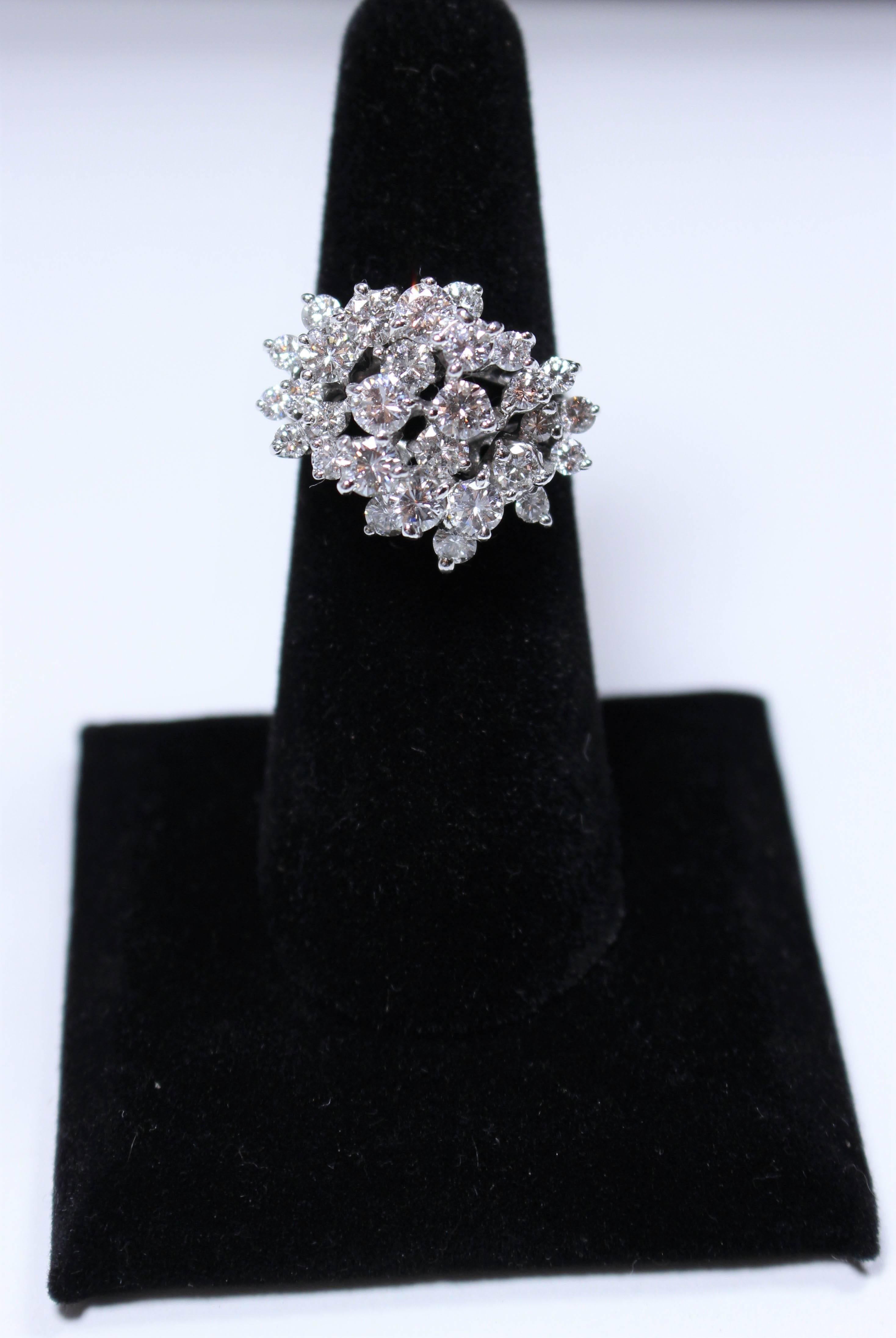 This ring is composed of 18kt white gold and features a stunning cascading diamond design. Size 7 easily sizable.

Please feel free to ask any questions you may have, we are happy to assist. 

Specs:
18 KT White Gold
Diamonds: 
30- Round Cut