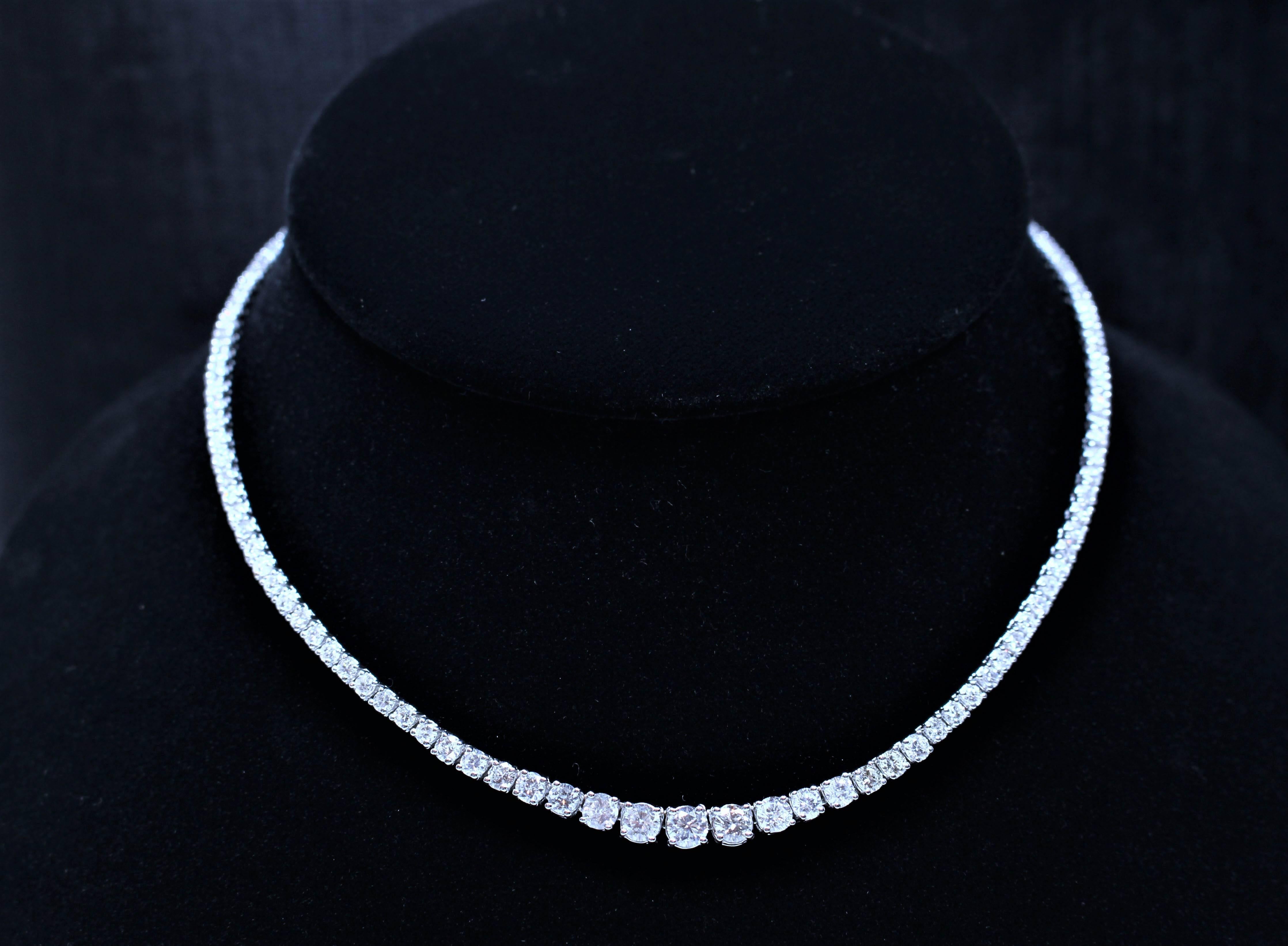 This necklace is composed of 18KT white gold with stunning round cut diamonds. Features a Riviere design with graduated diamonds. A beautiful classic style. In excellent condition.

Please feel free to ask any questions you may have, we are happy to