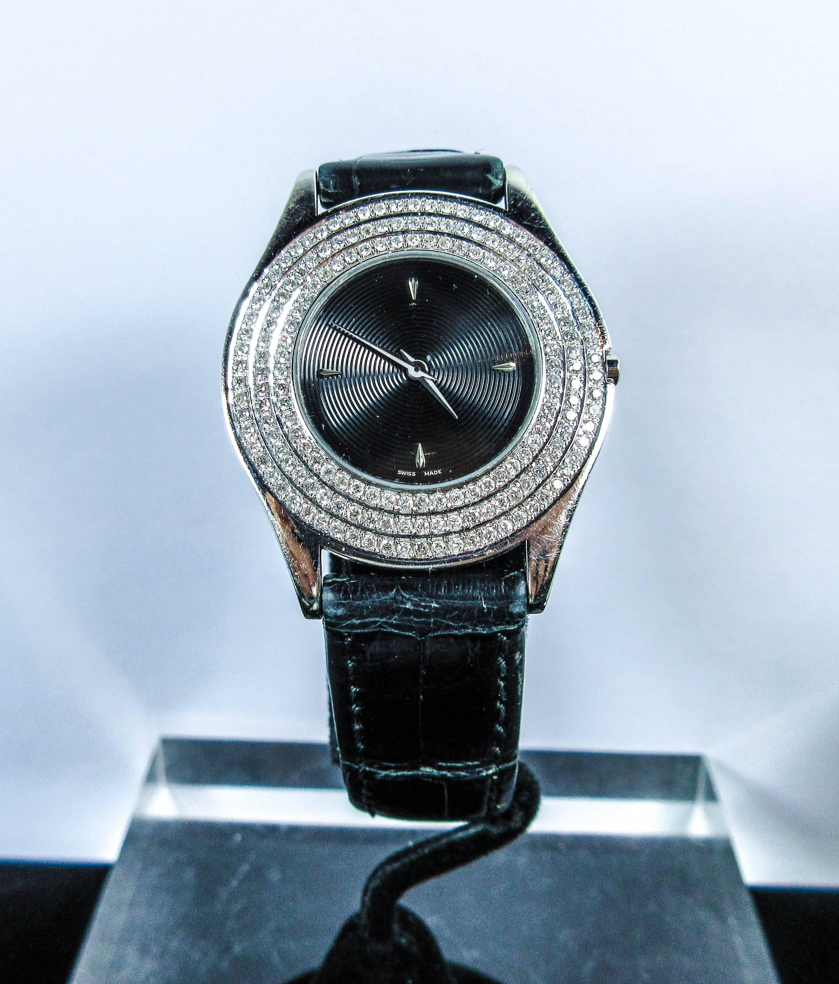 This Maubossin watch is composed of a black alligator band and diamond pave face. In excellent pre-owned condition.

Please feel free to ask any questions you may have, we are happy to assist. 

Size: 
Band
Length: 6.25"-7.25"

Face
Width: