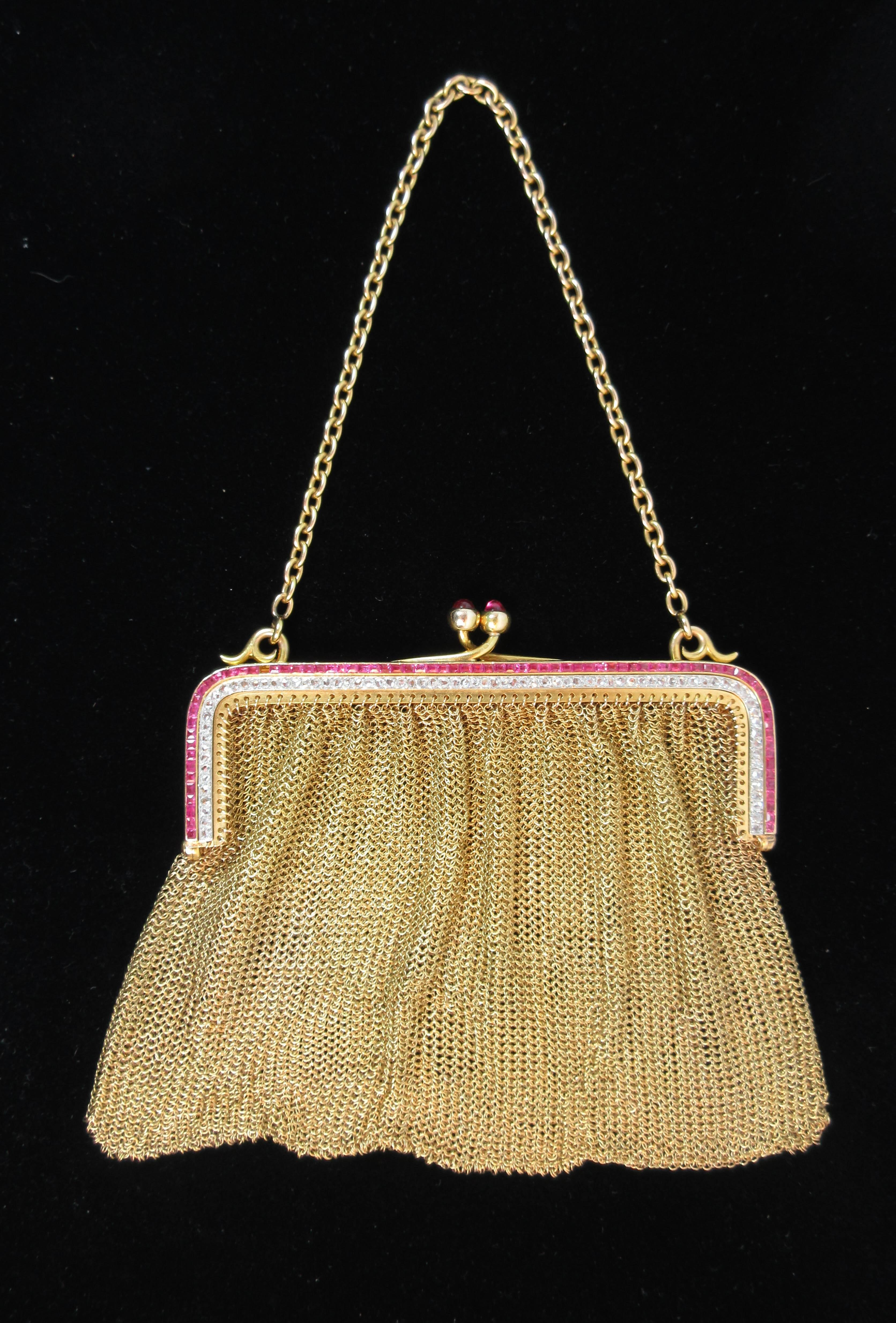 This vintage evening purse is composed of 18kt yellow gold and features a stunning array of pave Rubies & Diamonds.  Mesh design with frame can have an additional silk lining added. In excellent condition.

Please feel free to ask any questions