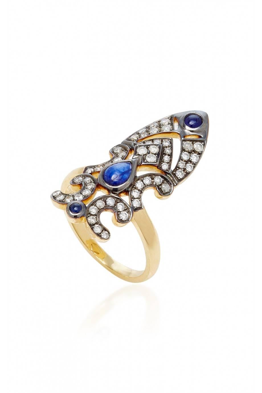 Ring in 18K Yellow gold 5gr approx.
Grey diamonds 0,45 carats approx.
Blue Sapphire 0,85 carats approx.
