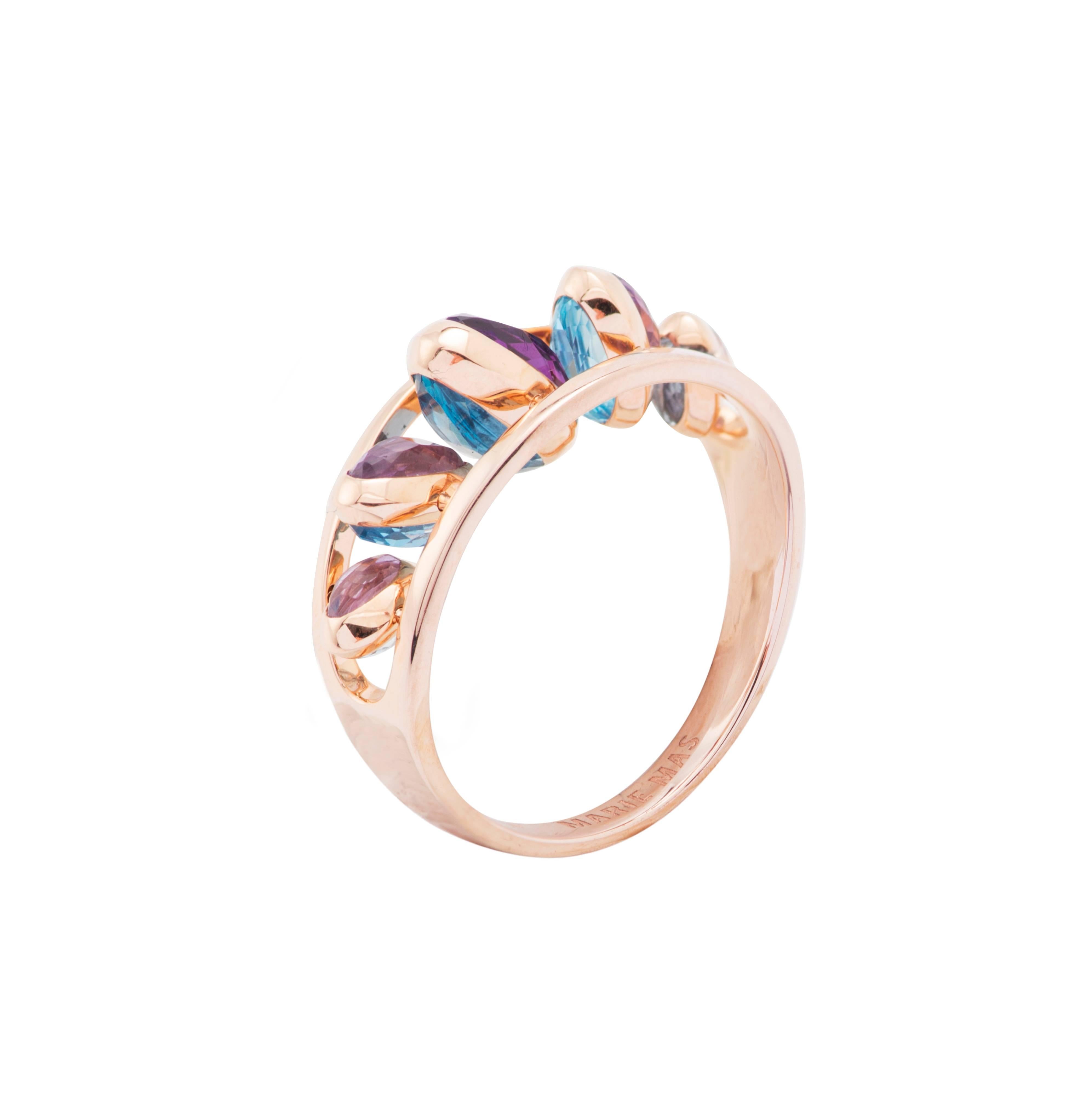 This Dancing Ring from the French Jewelry brand Marie Mas, is made in 18 Karat Rose Gold. All the stones can move like dominos, from one side to the other, from a shade of blue to a shade of purple. You can turn them to choose the side you want to