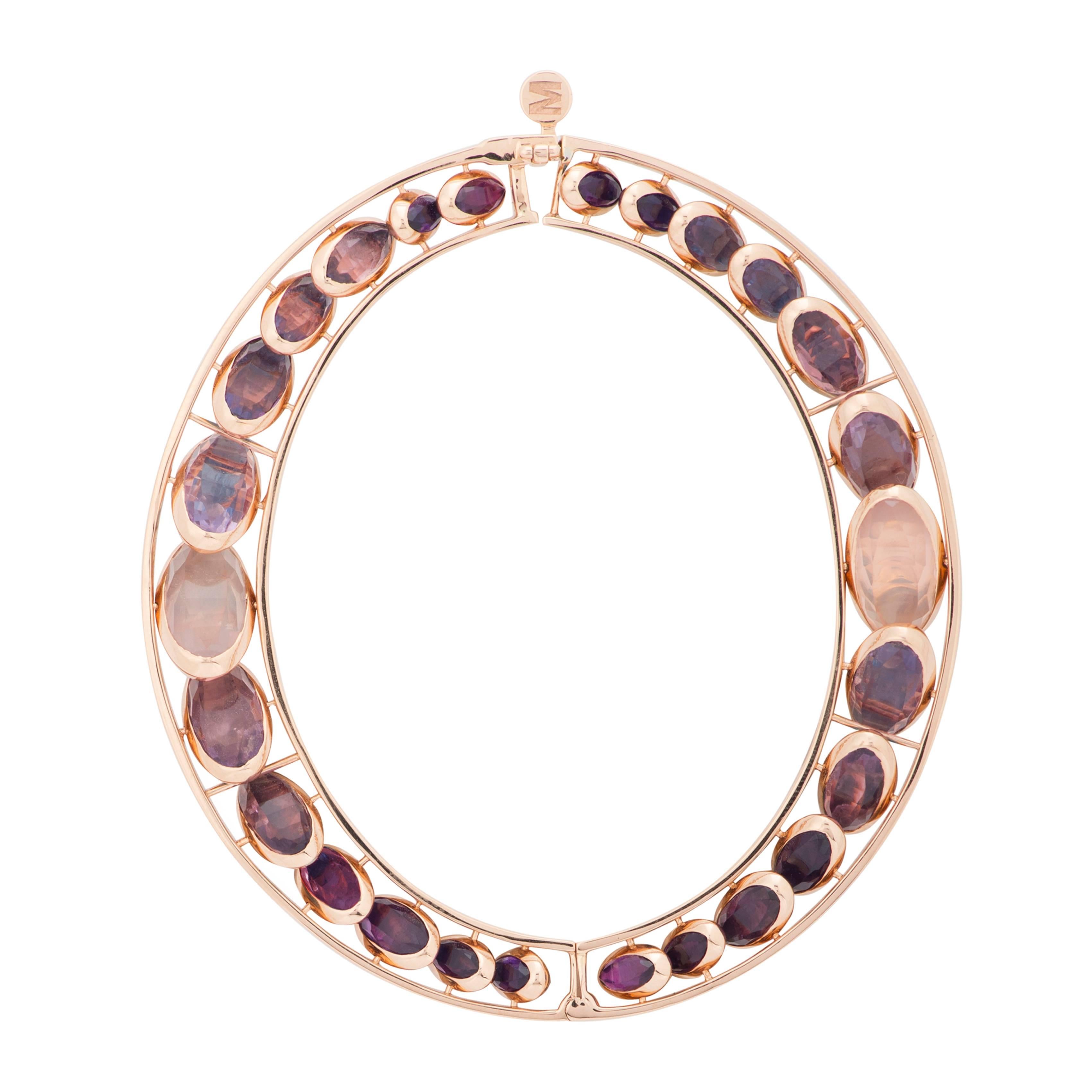 This Reversible Front Dancing Bracelet from the French Jewelry brand Marie Mas is made in 18 Karat Rose Gold (48 gr). All the stones can move like dominos, from one side to the other, from a shade of blue to a shade of pink. You can turn them to