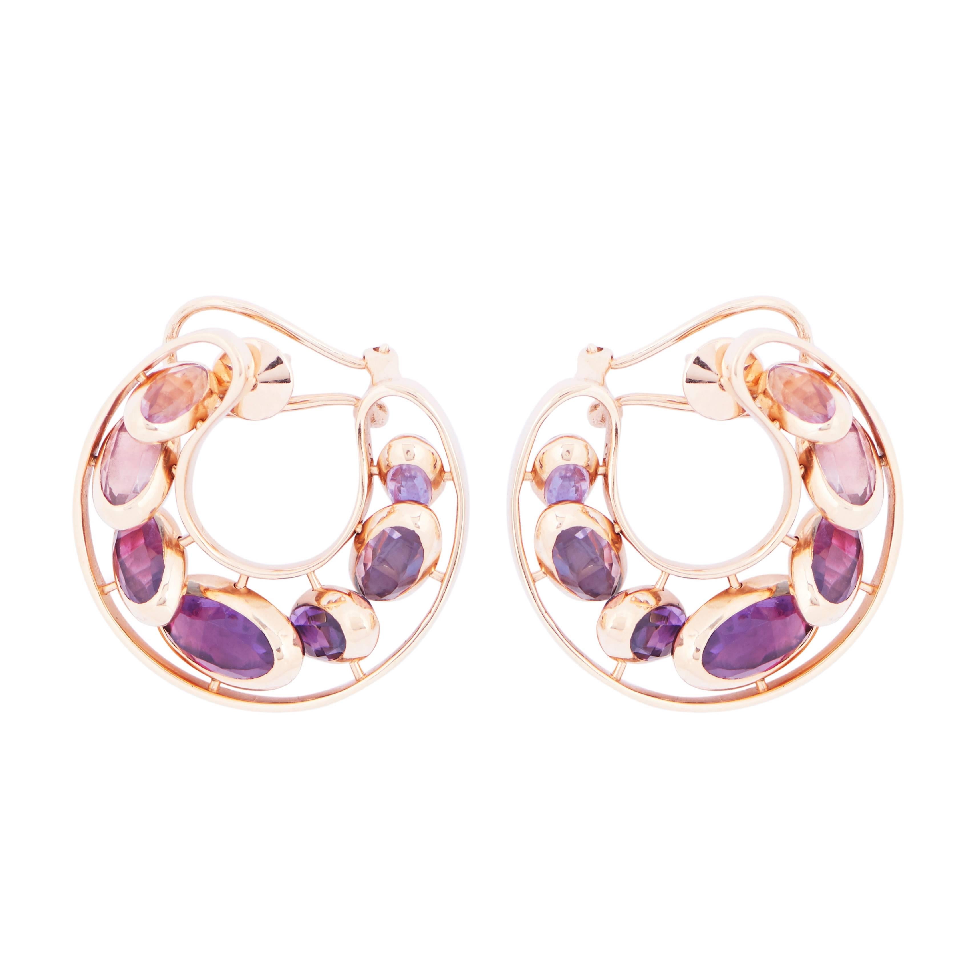 This pair of Reversible Hoop Earrings, from the French Jewelry brand Marie Mas, is made in 18 Karat Rose Gold. All the stones can move like dominos, from one side to the other, from a shade of blue to a shade of purple. You can turn them to choose