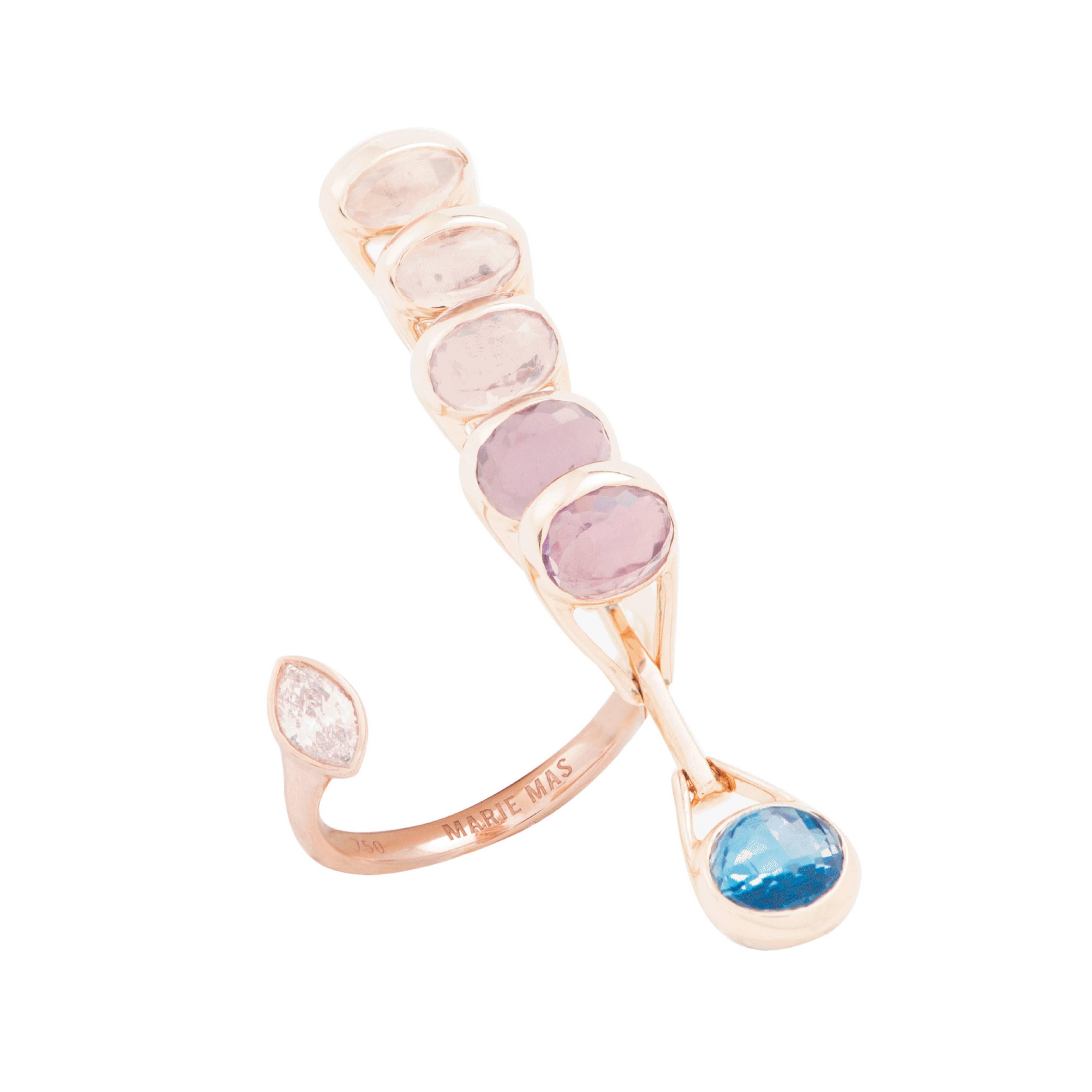 This Reversible Dancing Open Ring from the French Jewelry brand Marie Mas is made in 18 Karat Rose Gold. When you move you hand, the ring is moving with you and changing color. All the stones are articulated and can move like dominos, from one side