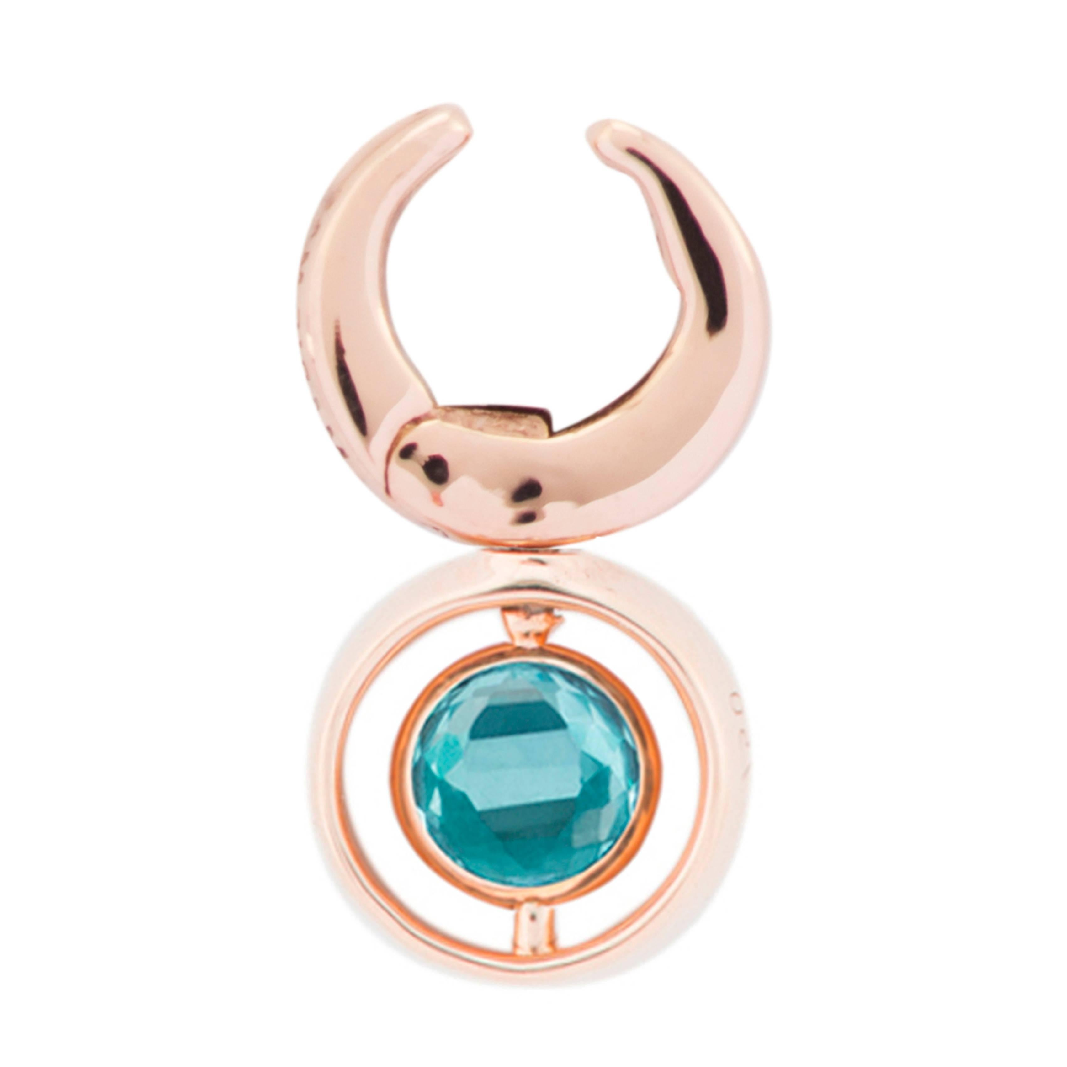 This Single Clip Earring is designed by the French Jewelry brand Marie Mas, it is in 18 Karat Rose Gold, with Diamonds, Pink Amethyst and London Blue Topaz. The center stone is reversible : there is a Pink Amethyst and a London Blue Topaz back to