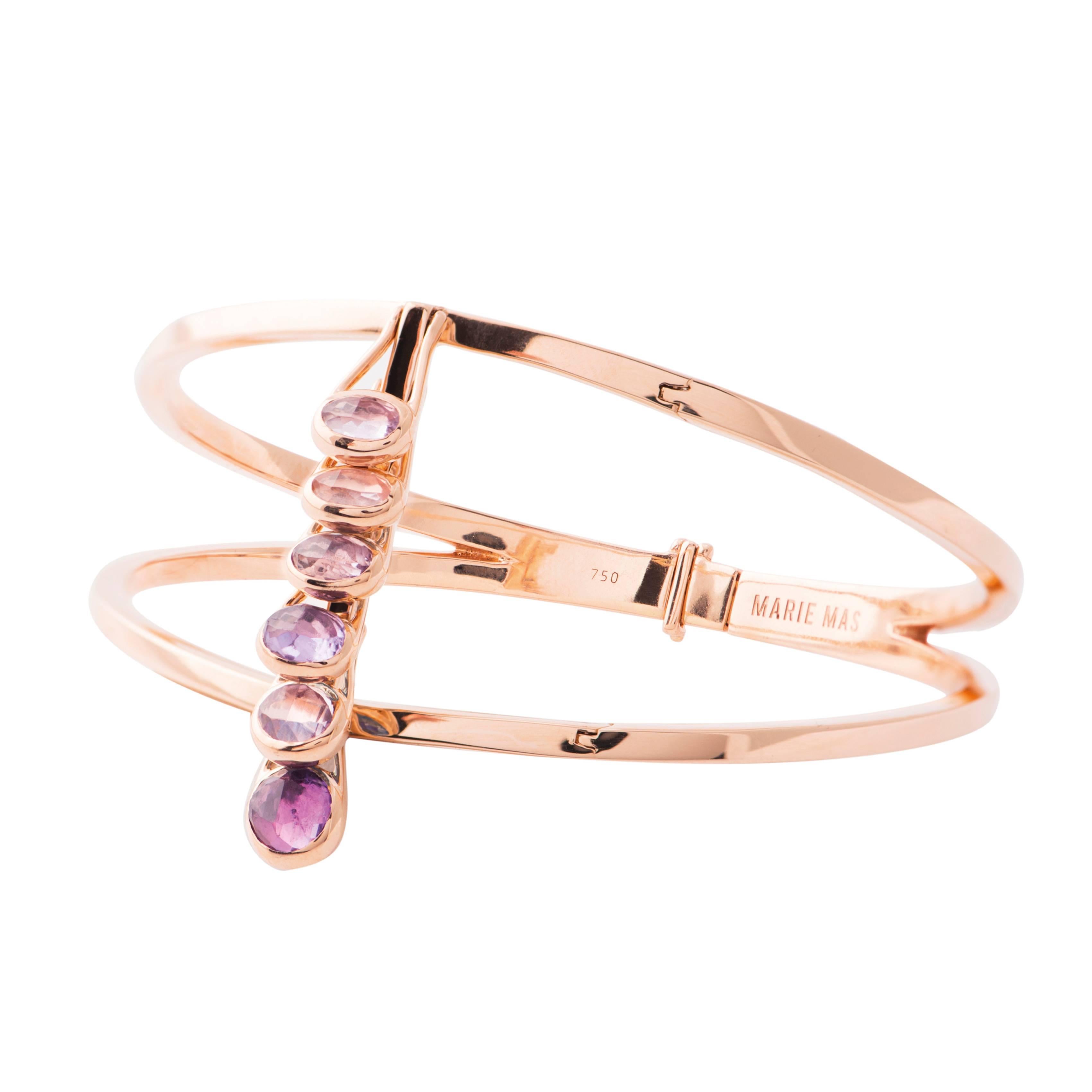 This Reversible Bracelet from the French Jewelry brand Marie Mas is made in 18 Karat Rose Gold. When you move you arm, the bracelet is moving with you and changing color. All the stones are articulated and can move like dominos, from one side to the