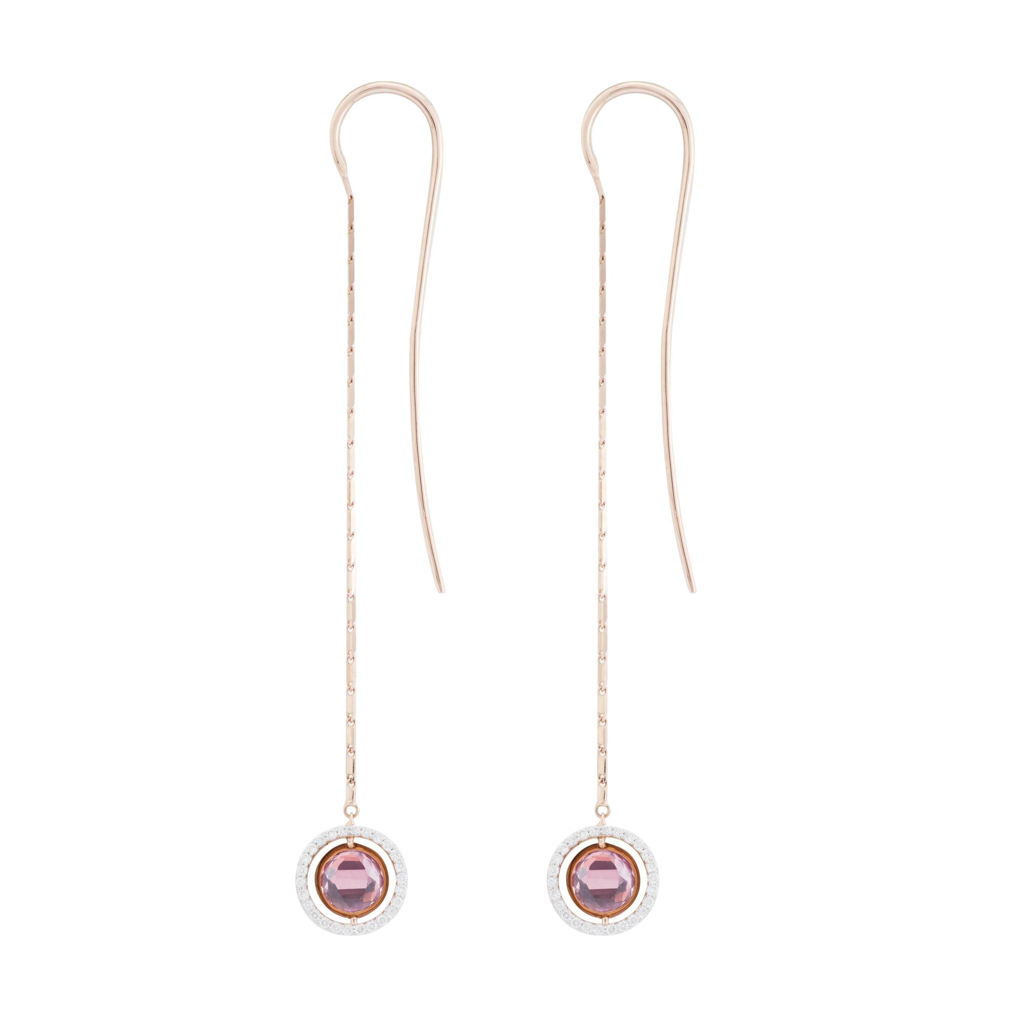This pair of long earrings are from the French Jewelry brand Marie Mas. 
They are made in 18 Karat Rose Gold and are 7,5 cm long. The diameter of the round element is 10 mm.
On each Earring, the round element is reversible : there is a Pink Amethyst