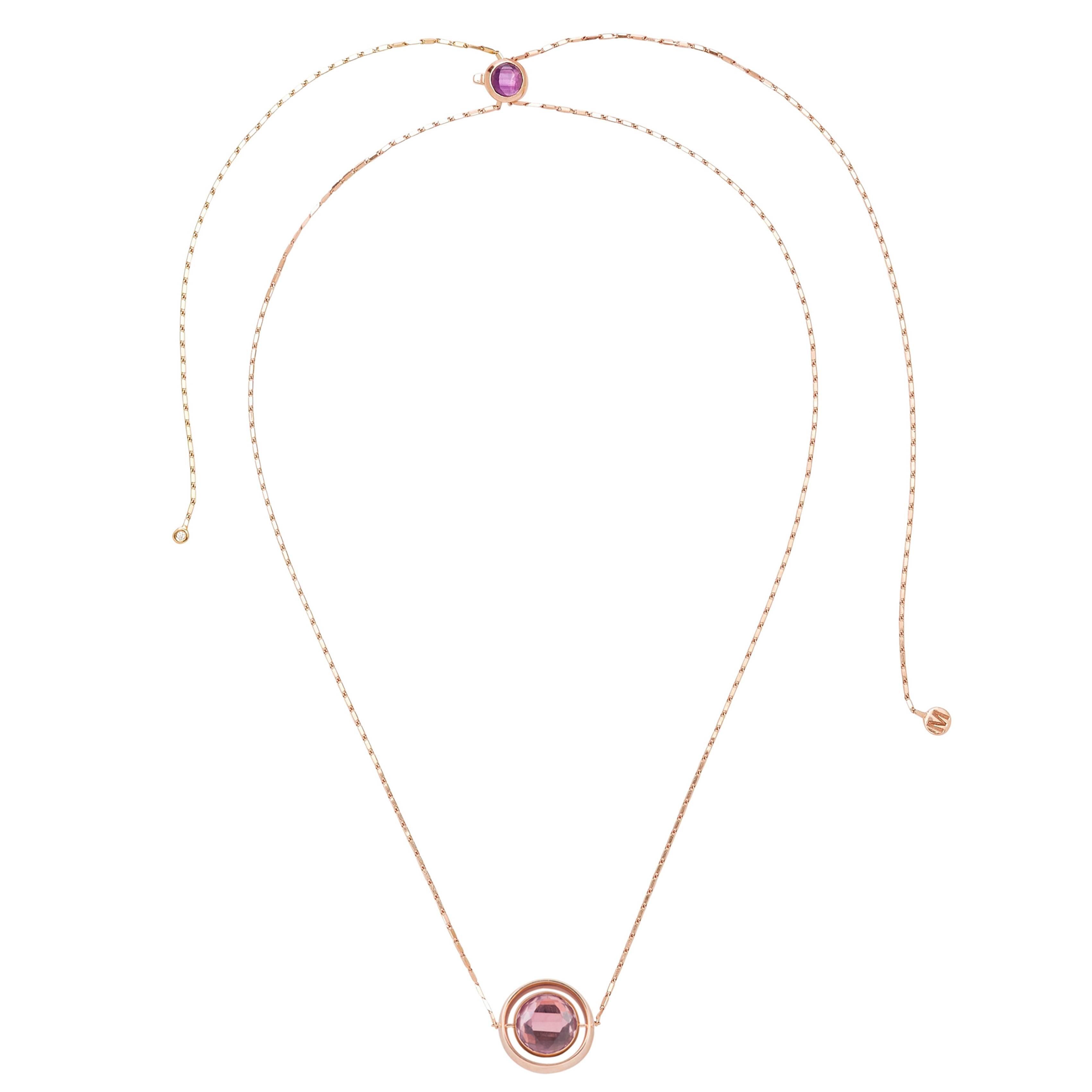This Large Swiveling Necklace L is designed by the French Jewelry brand Marie Mas. 
The necklace is in 18 Carat Pink Gold, with Diamonds, Pink Amethyst and London Blue Topaz. The center stone is reversible : there is a Pink Amethyst and a London