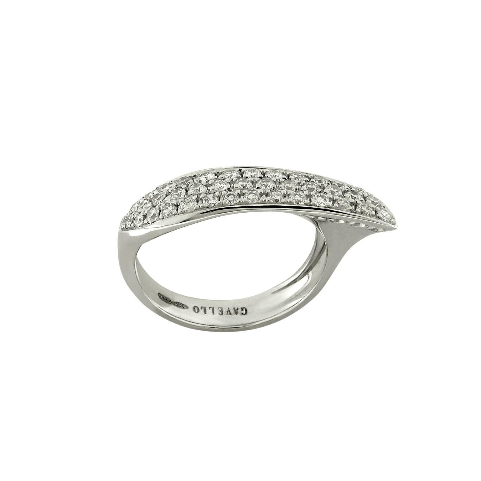 Timeless contemporary sculptured band ring in 18k white gold. The ring features a slim, wing-shaped, ergonomical design originally conceived for the right hand and white diamond pavé of 0.70ct. 
Ring size 6.5, EU 53.  
Signed and hallmarked Gavello.