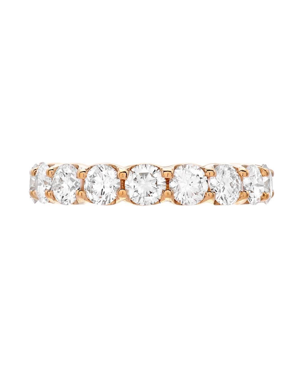 This simple eternity band crafted in 18 karat yellow gold is handset with 3.31 carats of matching 3.8 mm round white VS 1 G color diamonds. The ring is a standard US size 6.5.

Designed and made in Los Angeles - 2016. 

All items can be ordered in a