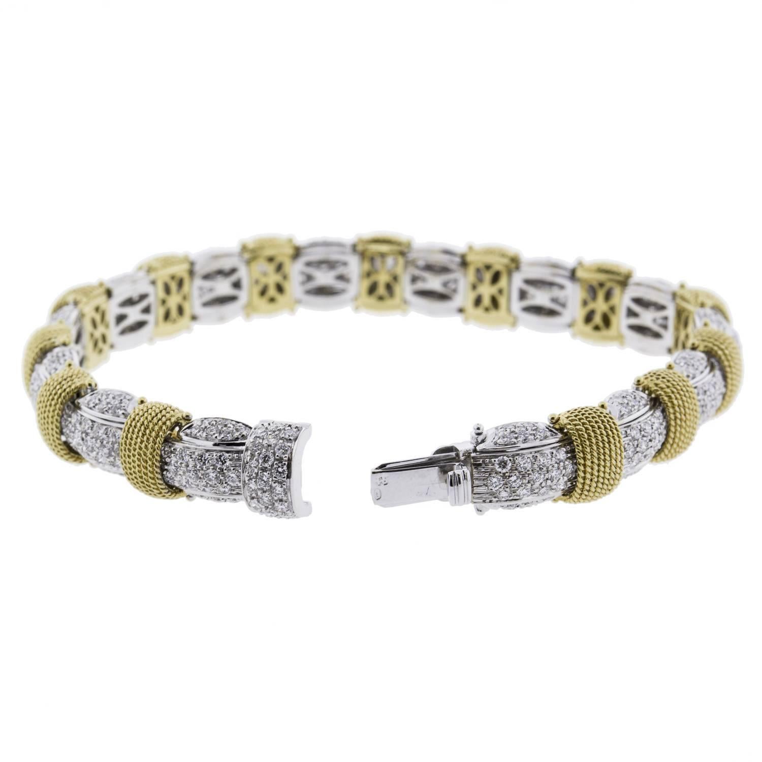 If you like more than just plain tennis bracelets, you'll love this two-color gold diamond bracelet by Roberto Coin! This beautiful bracelet is made of fine 18K gold, in two tones: white, and gold. Encrusted with round brilliant diamonds of 6.82twt.