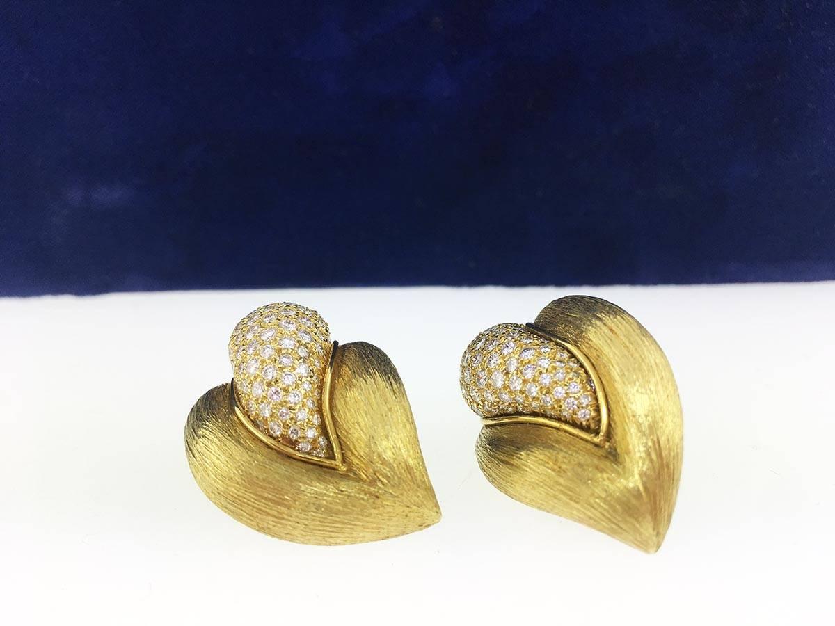 Crafted in 18K yellow gold these ear clips are nice and heavy. Make a statement without being too flashy. 
Measurements: 3cm long, 2cm wide
Diamonds: Round Brilliant Cuts
Quality: F-G color, VS-SI 
Carat Weight: 1.92cts
Paperwork: Appraisal Of