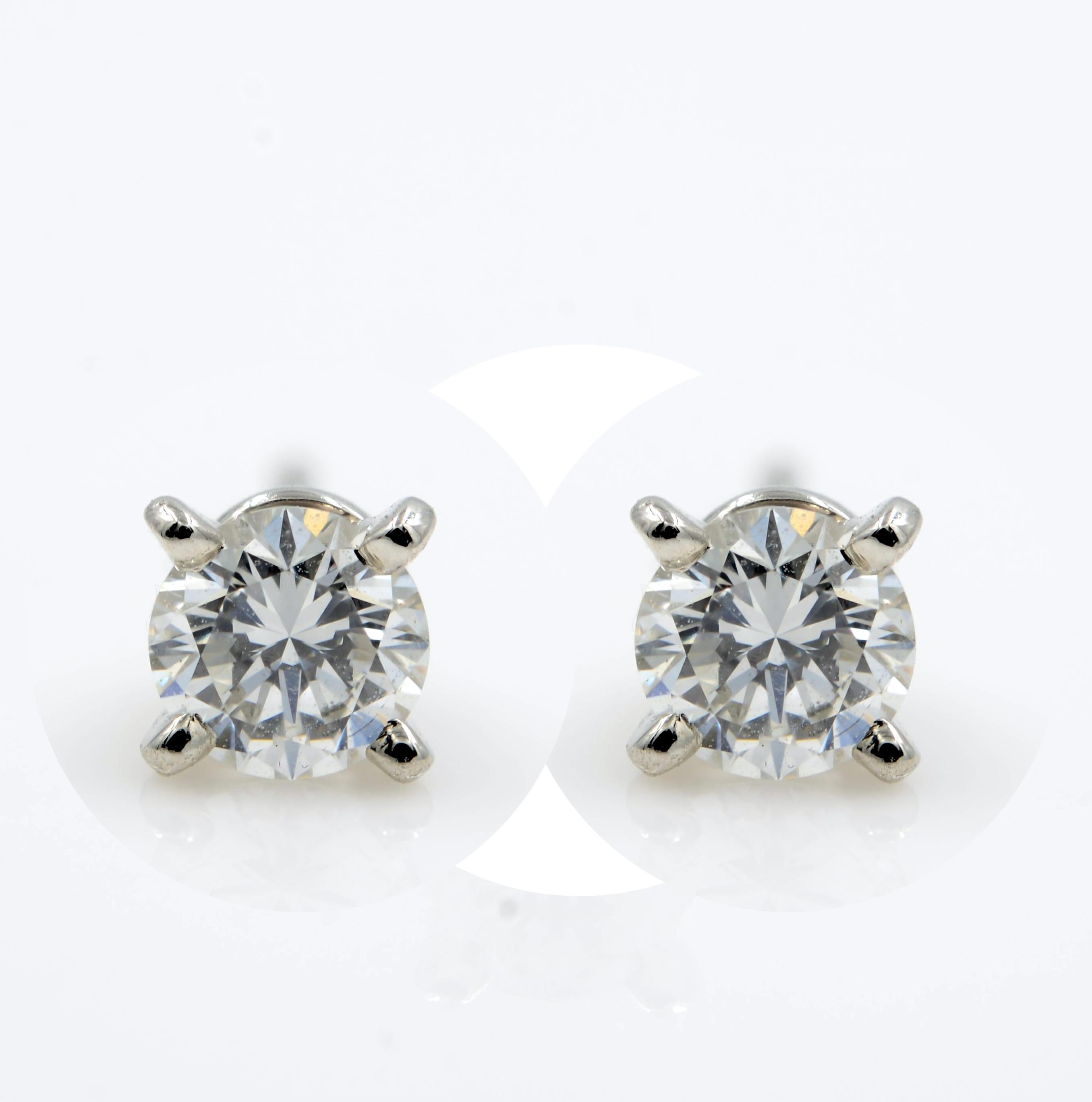 Modern Cartier Diamond Round Cut Stud Earrings GIA 0.49 Carat Platinum
