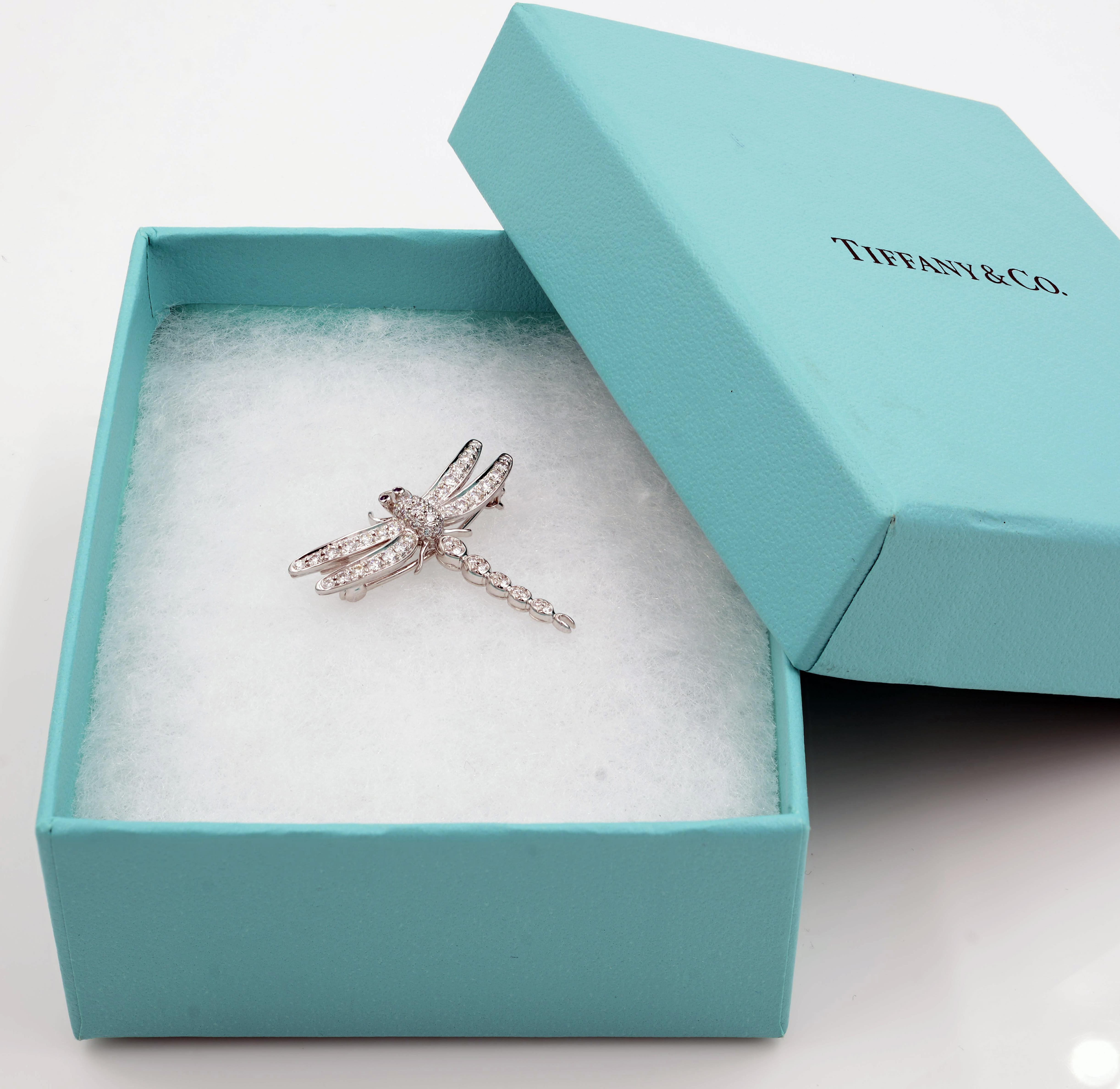 Details:
TIFFANY Platinum Diamond Enchant Dragonfly Necklace crafted in Platinum. This whimsical pendant brooch is crafted on platinum with pave set round cut diamonds of highest quality. The delicate dragonfly has eye made of gemstones and