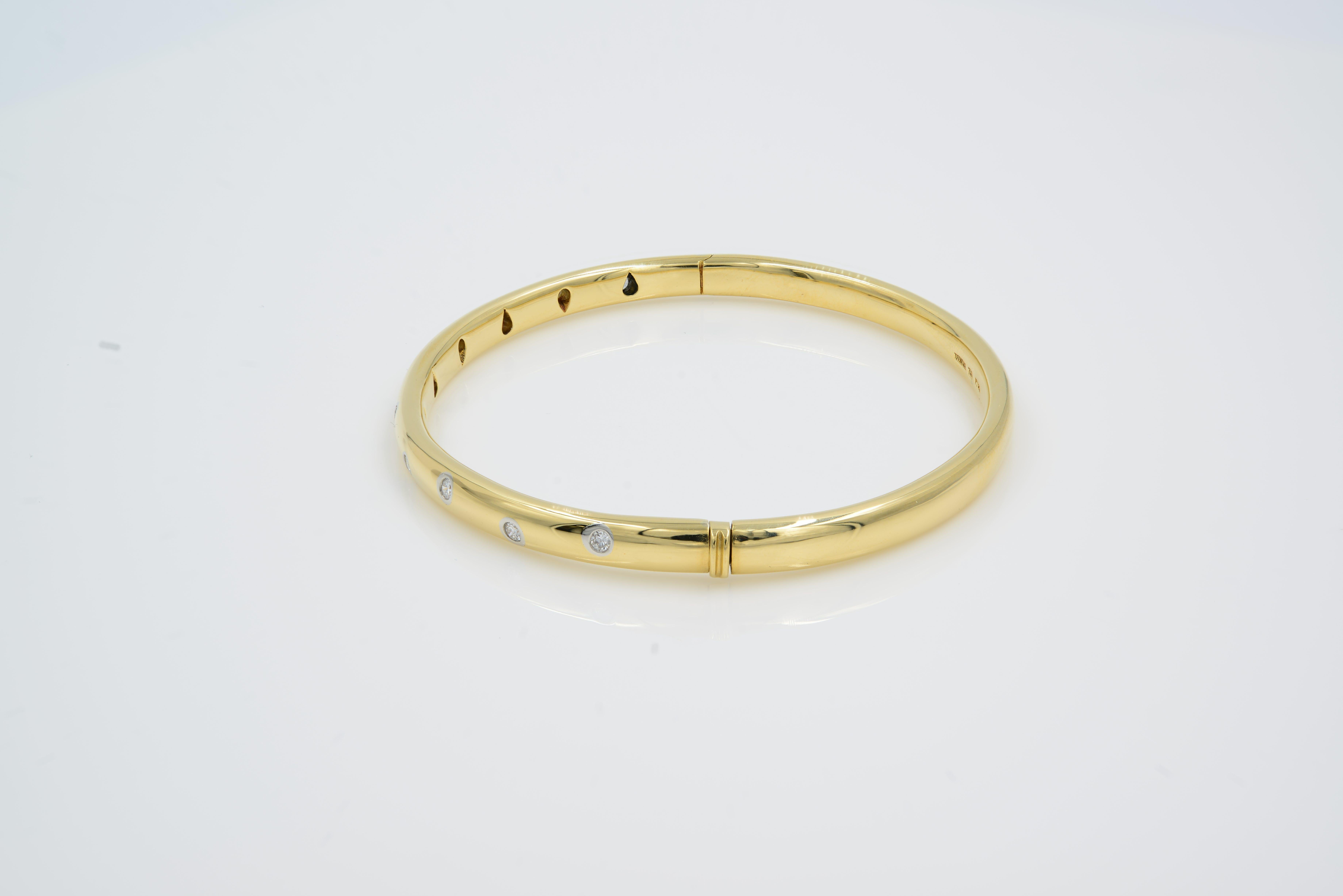 Tiffany Etoile Yellow Gold Diamond Bangle 0.21cts SZ 16
18K gold with round brilliant diamonds
Size medium
Fits wrists up to 6.25Carat total weight 0.21cts

Details:
Brand	Tiffany & Co
Material	Yellow Gold
Bracelet Length	16
Bracelet