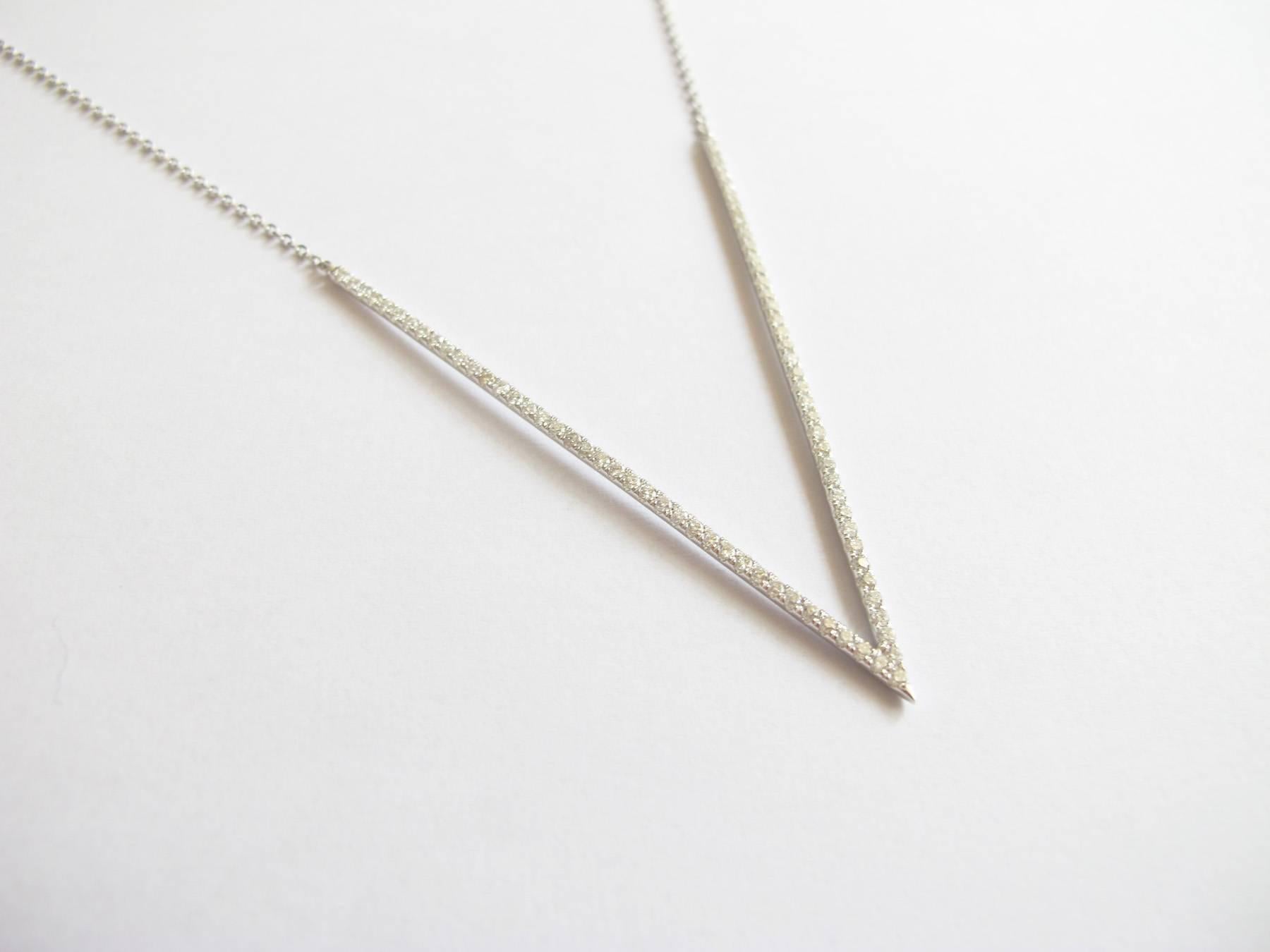 This 18K white gold diamond 'V' necklace is clean and minimalist, and will be a subtle addition to any modern wardrobe.  

Necklace length: 19 inches with ability to clasp at 18 inches and 18.5 inches
Diamond weight: 0.77ct
