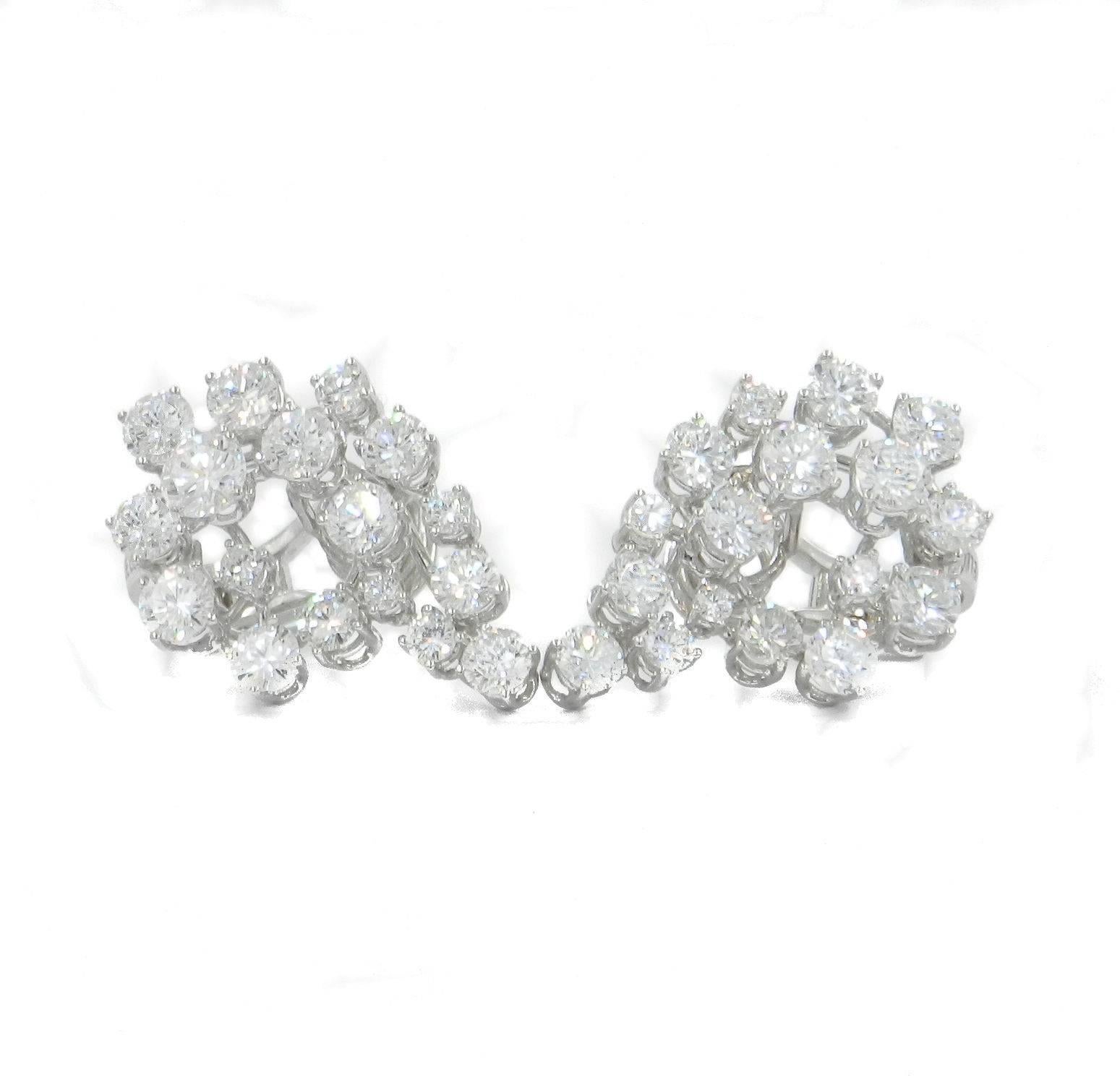 Hand made earrings with beautiful white diamonds in different sizes total carat weight 6.66, all shaped to create the letter G from the first owner name. Period 1960. Made In Italy