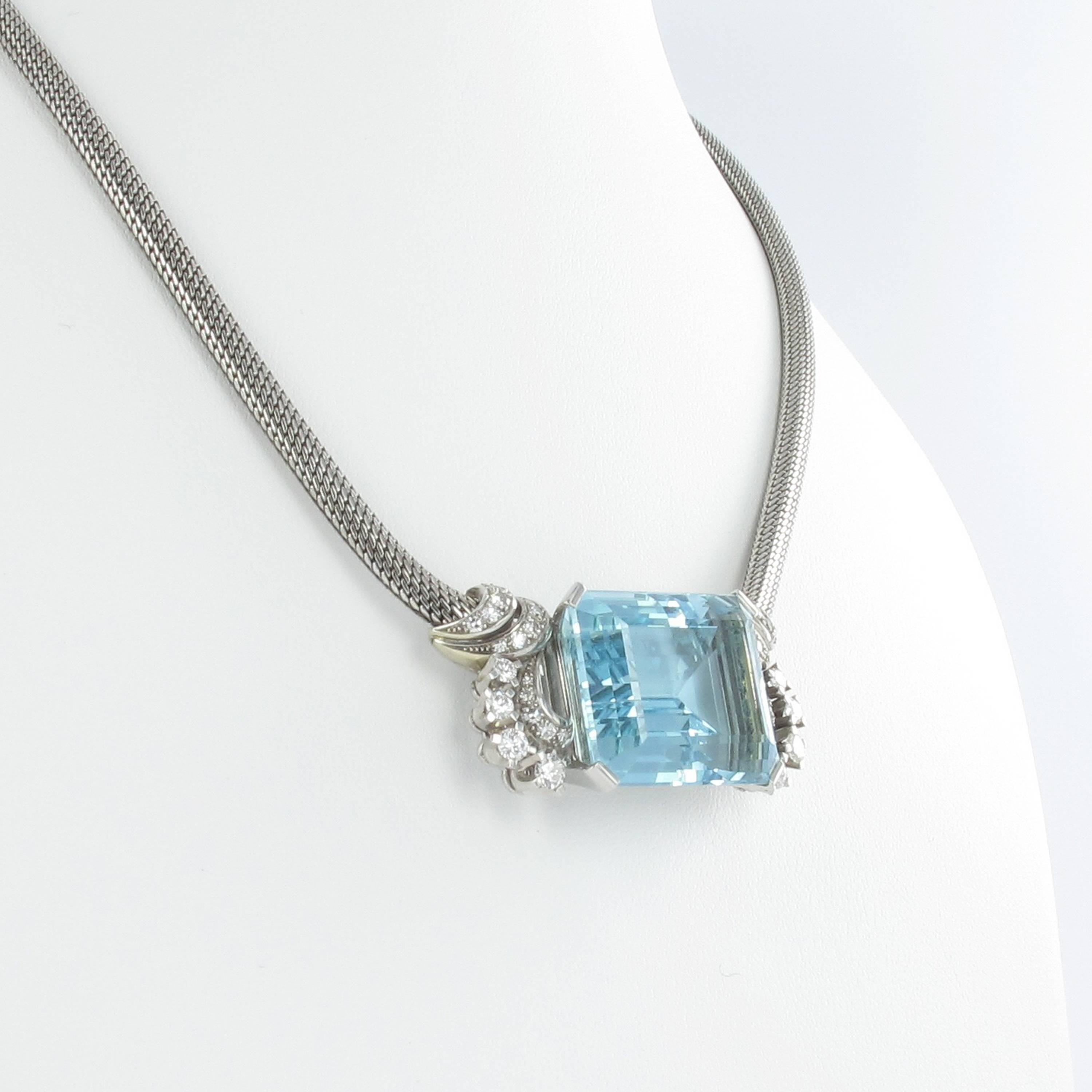 Impressive octagonal cut aquamarine of approx. 37.00 ct set in a 18K white gold necklace. Center stone is surrounded by 36 diamonds of total approx. 1.40 ct. Fine workmanship.

Stock no. 1000019734