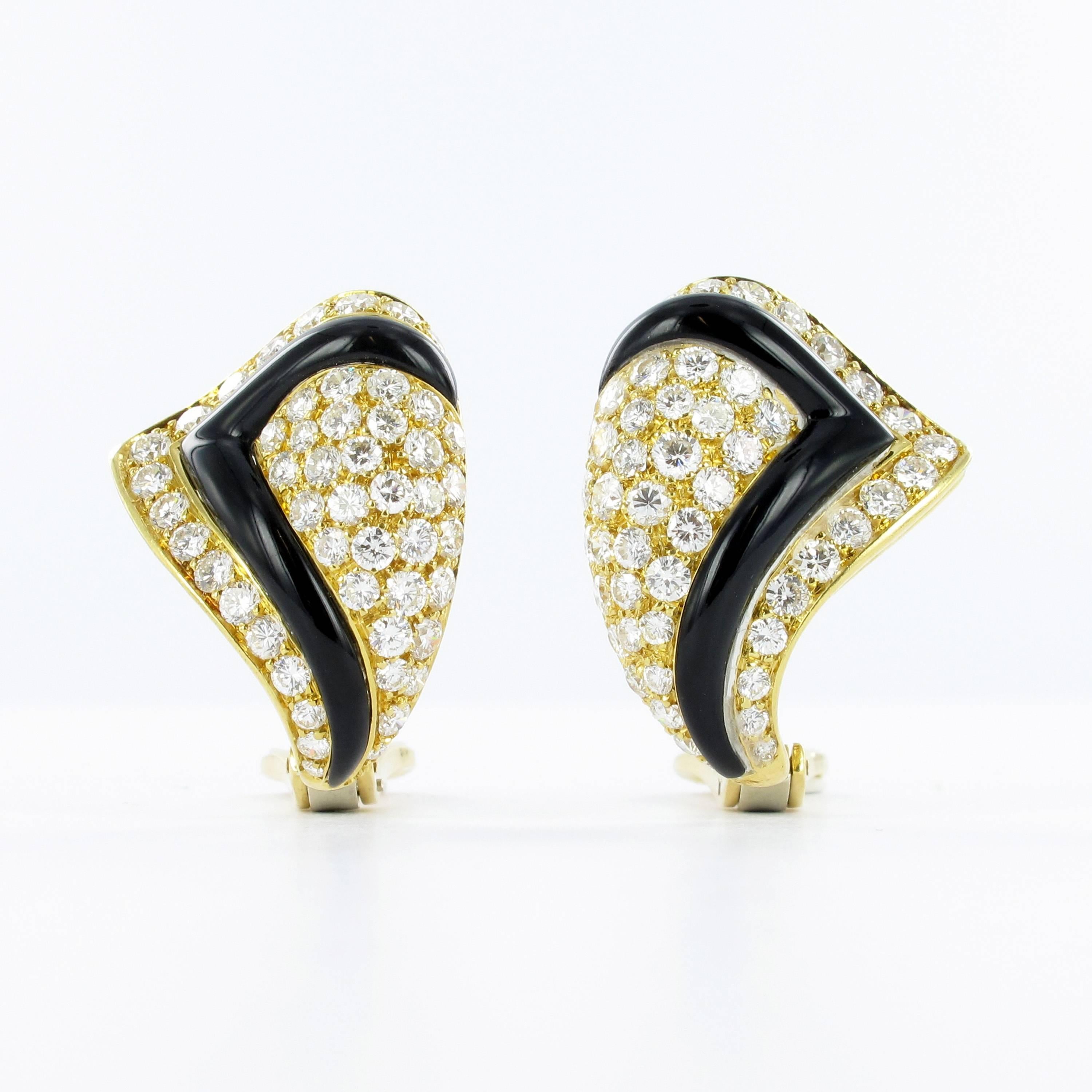 Pair of 18k yellow and white gold earrings with omega backs. Set with 98 round brilliant cut diamonds, total estimated diamond weight of 2.90 carats of G/H colour and vs clarity. Italian hallmarks for 18k gold.

Stock Number: 1000185237