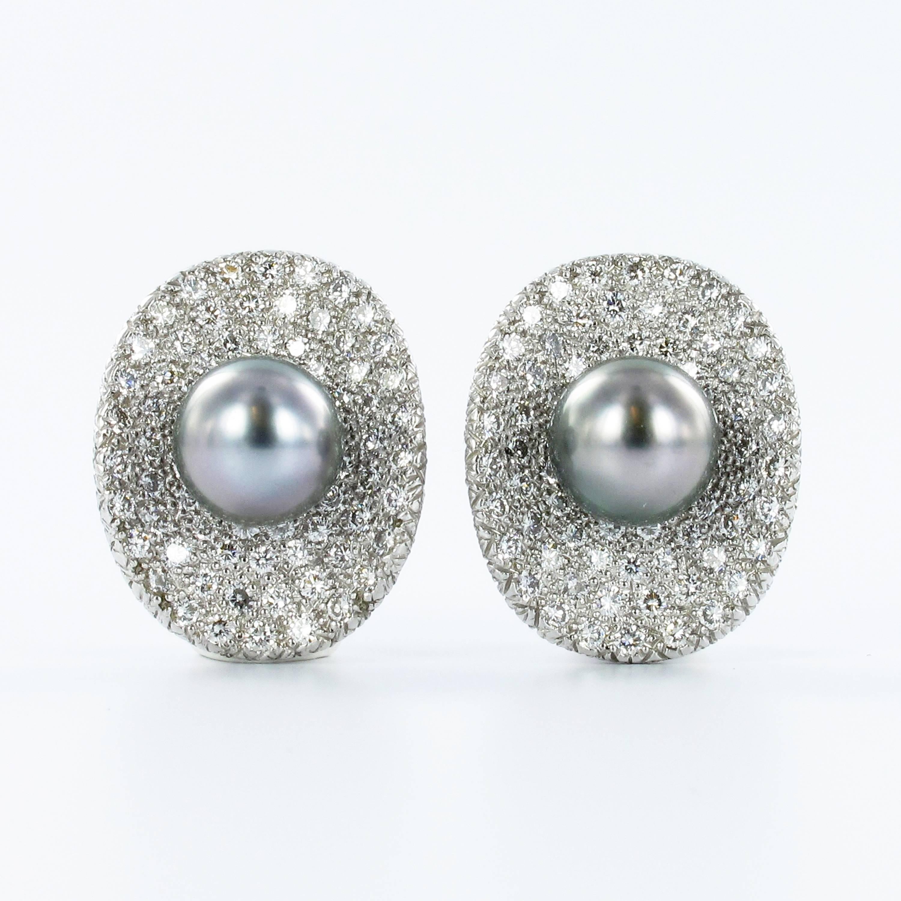 These handcrafted earclips in 18k white gold feature two attractive Tahitian cultured pearls of 9.1 mm diameter. The pearls are embedded in a field of 350 exqusitely pave set brilliant cut diamonds totalling 5.83 carats of G/H colour and vs clarity.