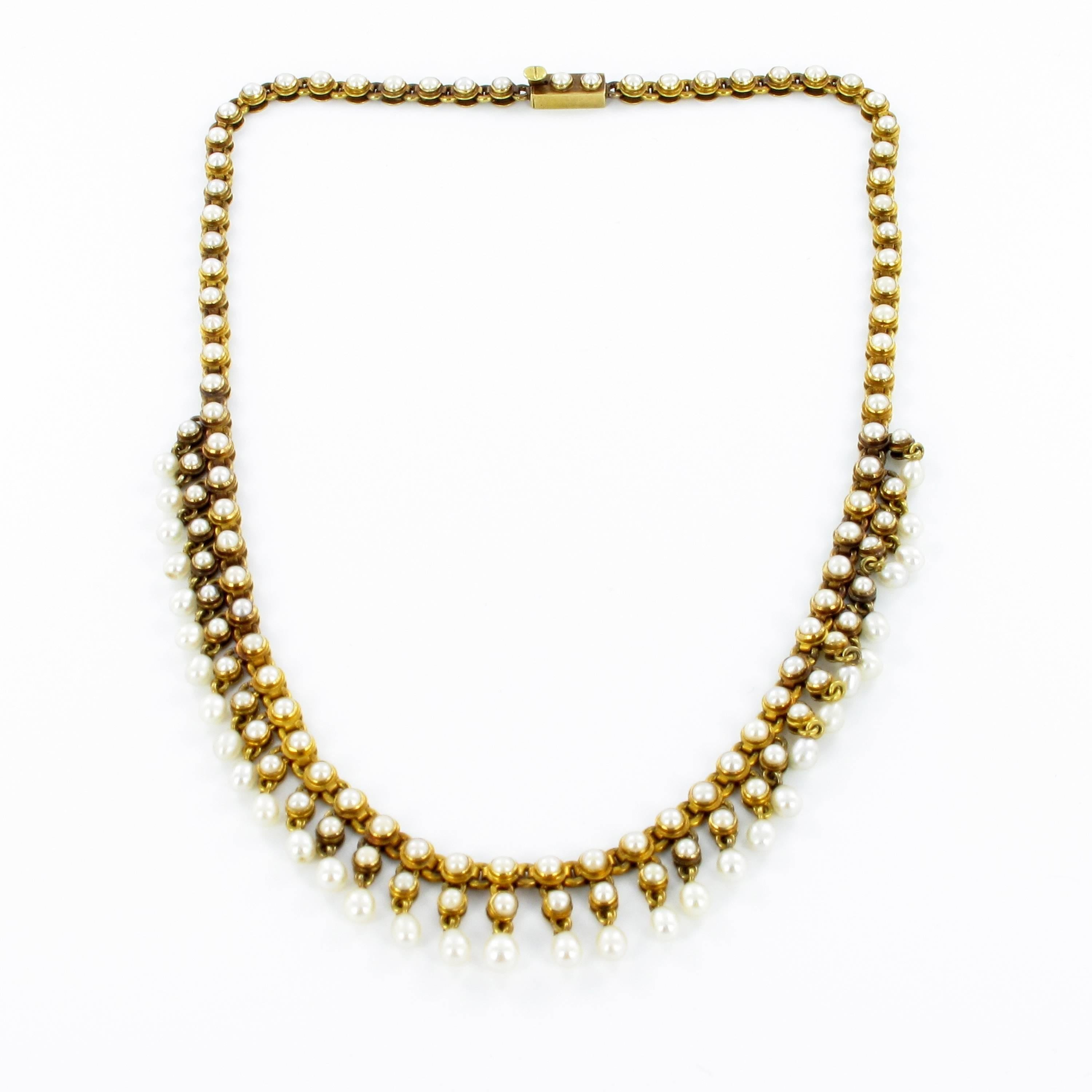 Victorian necklace created on the turn of 20th century. The necklace features 141 round and drop shaped natural pearls set in 18 k yellow gold. The diameters of the pearls range form 2.5 to 4.5 mm. The necklace is 38.5 centimeters long and weighs