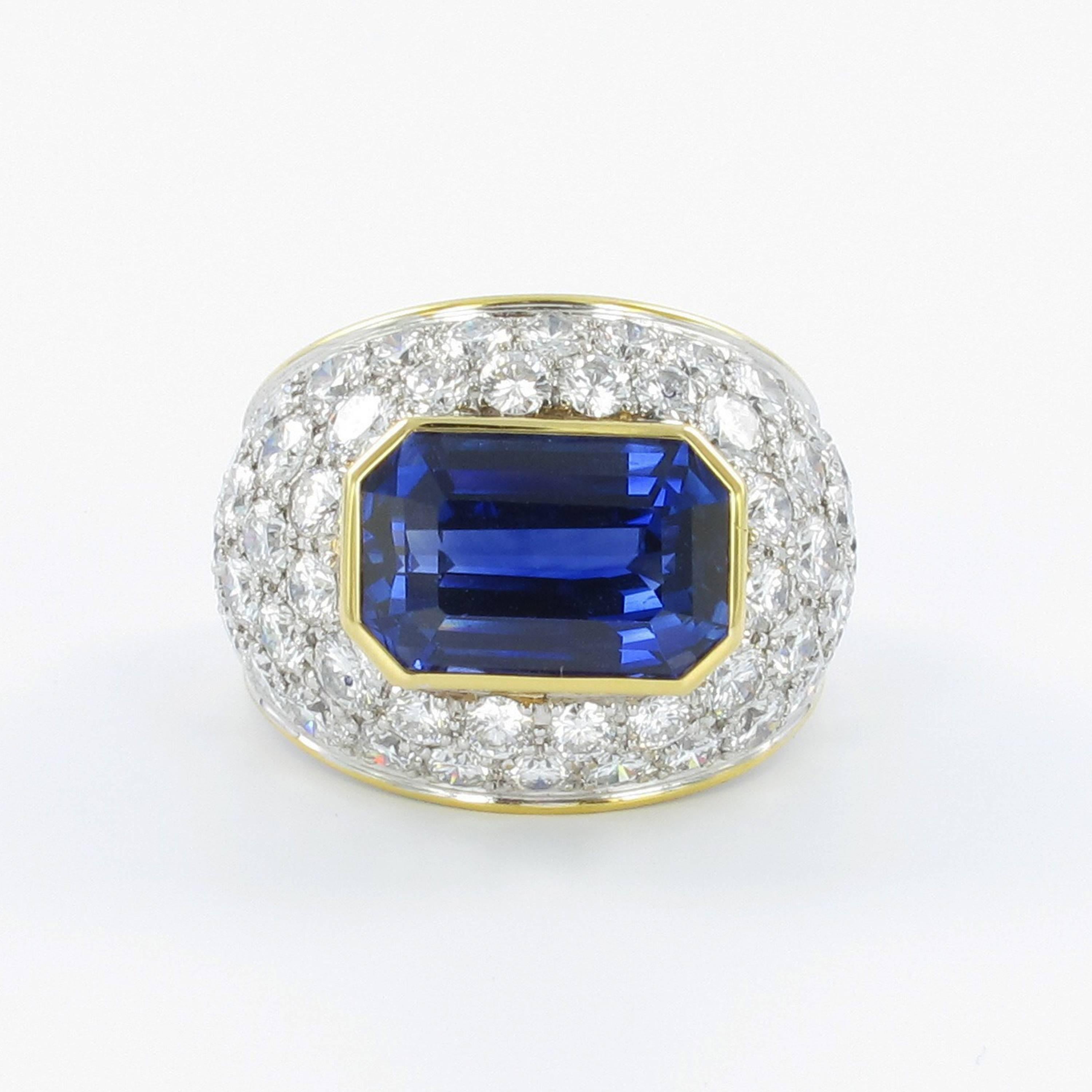 This gorgeous ring is set with an impressive emerald cut sapphire of approx. 10.30 ct surrounded by 50 brilliant cut diamonds totaling approx. 4 ct of G/H-vs quality. The sapphire of an intense blue colour seems to be heated.

Ring size: 55 EU / 7