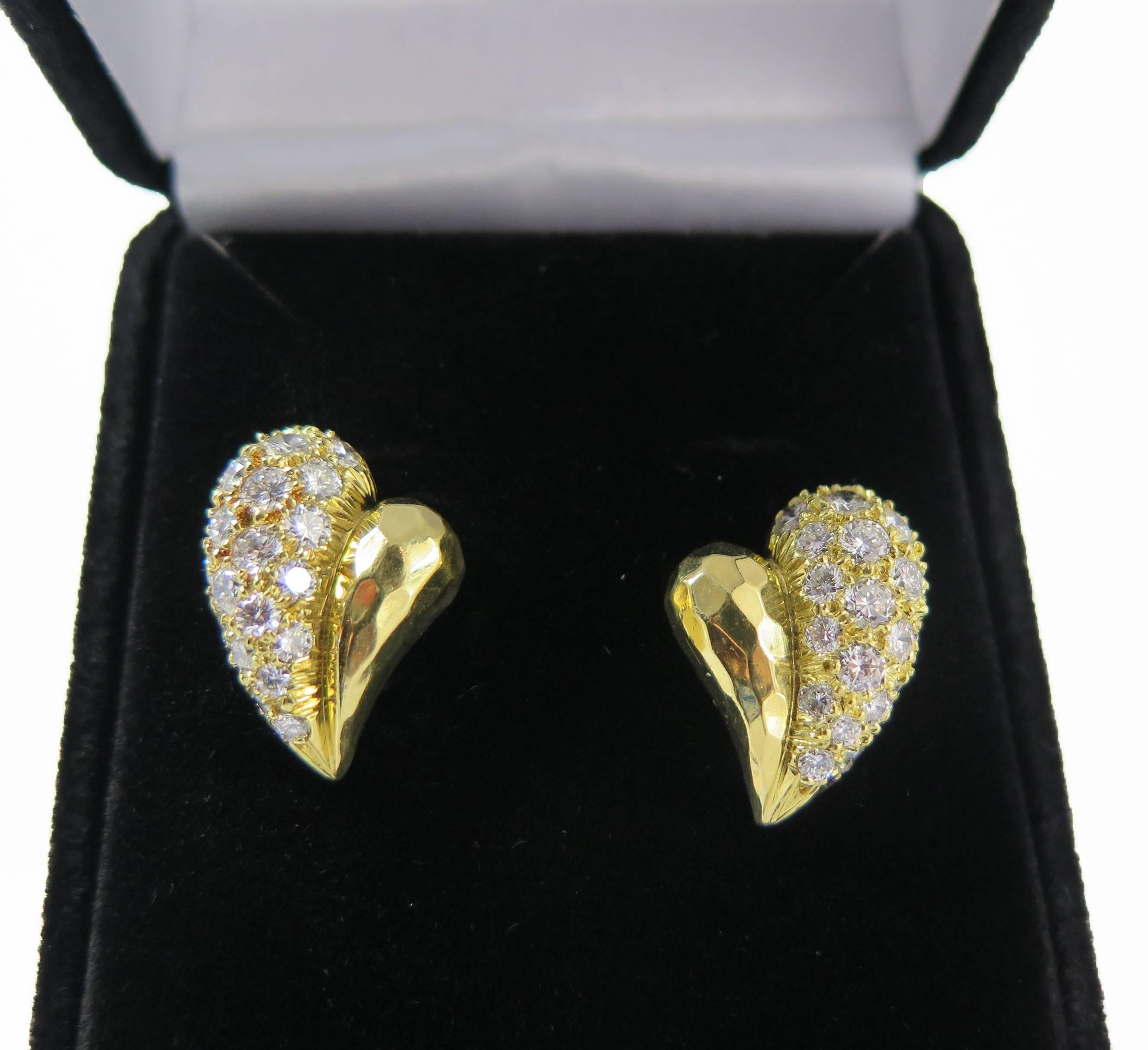 Beautiful pair of heart shape hand hammered 18K gold with diamonds earrings by Henry Dunay with post back. Diamonds are G/VS quality. Signed 