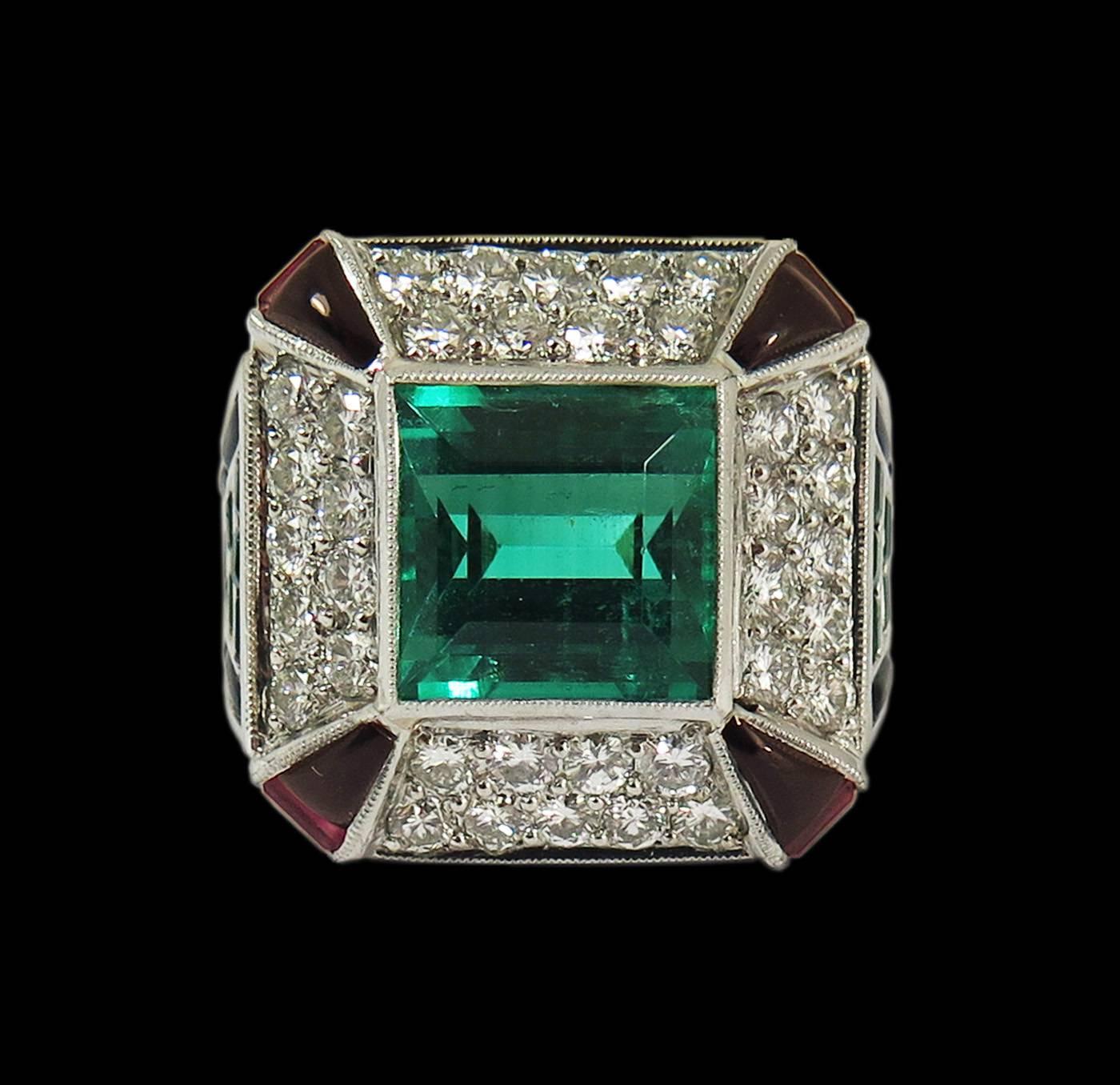 A very fine and rare Art Deco platinum ring a 4.0 ct emerald cut Colombian emerald of rich and deep green. The emerald is AGL certified as being of Colombian origin, with insignificant traditional treatment. 

Surrounding the emerald on each side