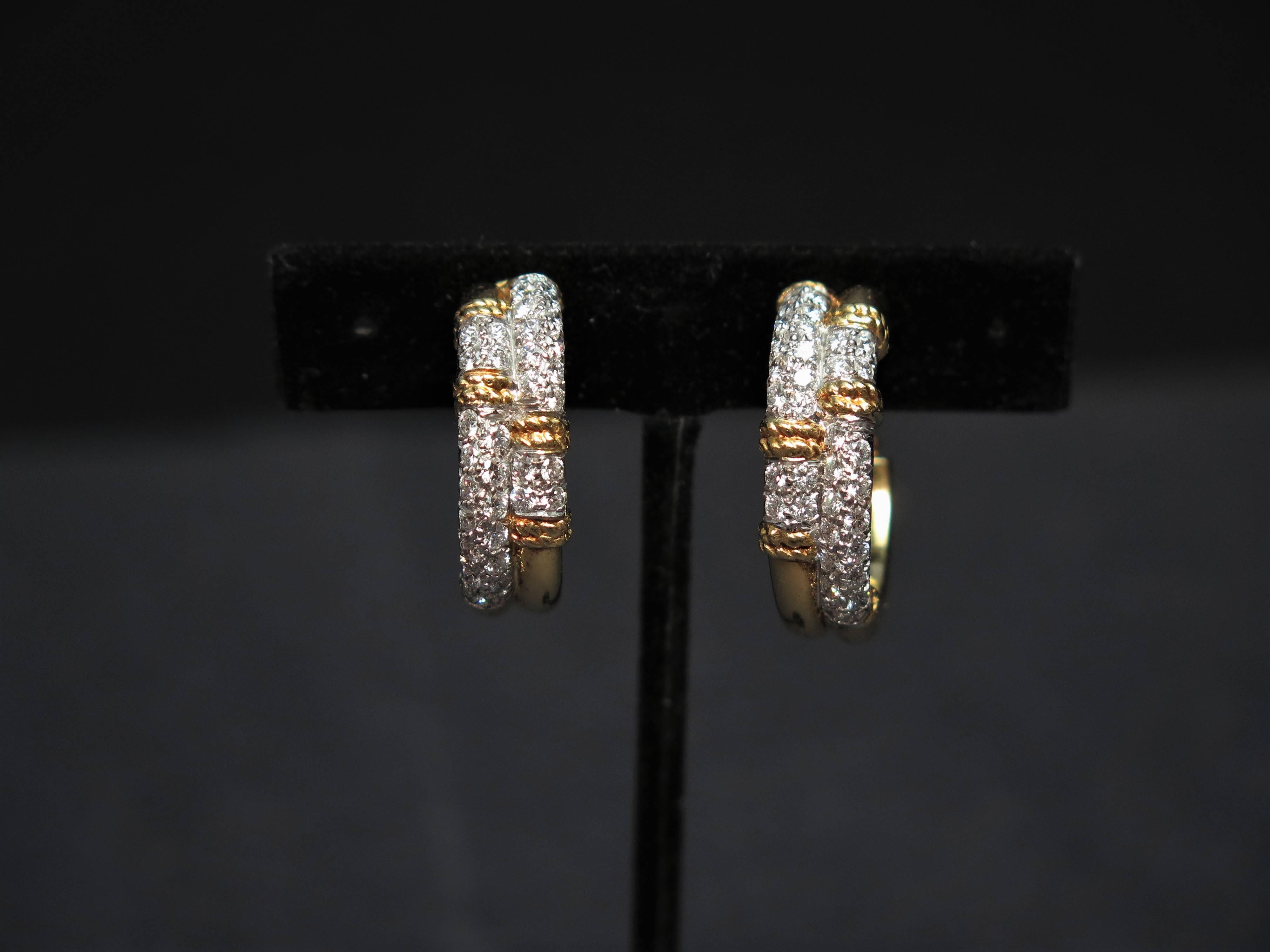 An elegance and classic 18 K yellow gold, diamonds hoop earrings by Kutchinsky dated to 1970. 
Diamonds weight 2.3 carats. Earrings total weight 41.0 grams. 29mm in length x 26mm x 9mm. Signed Kutchinsky. Clip backs.