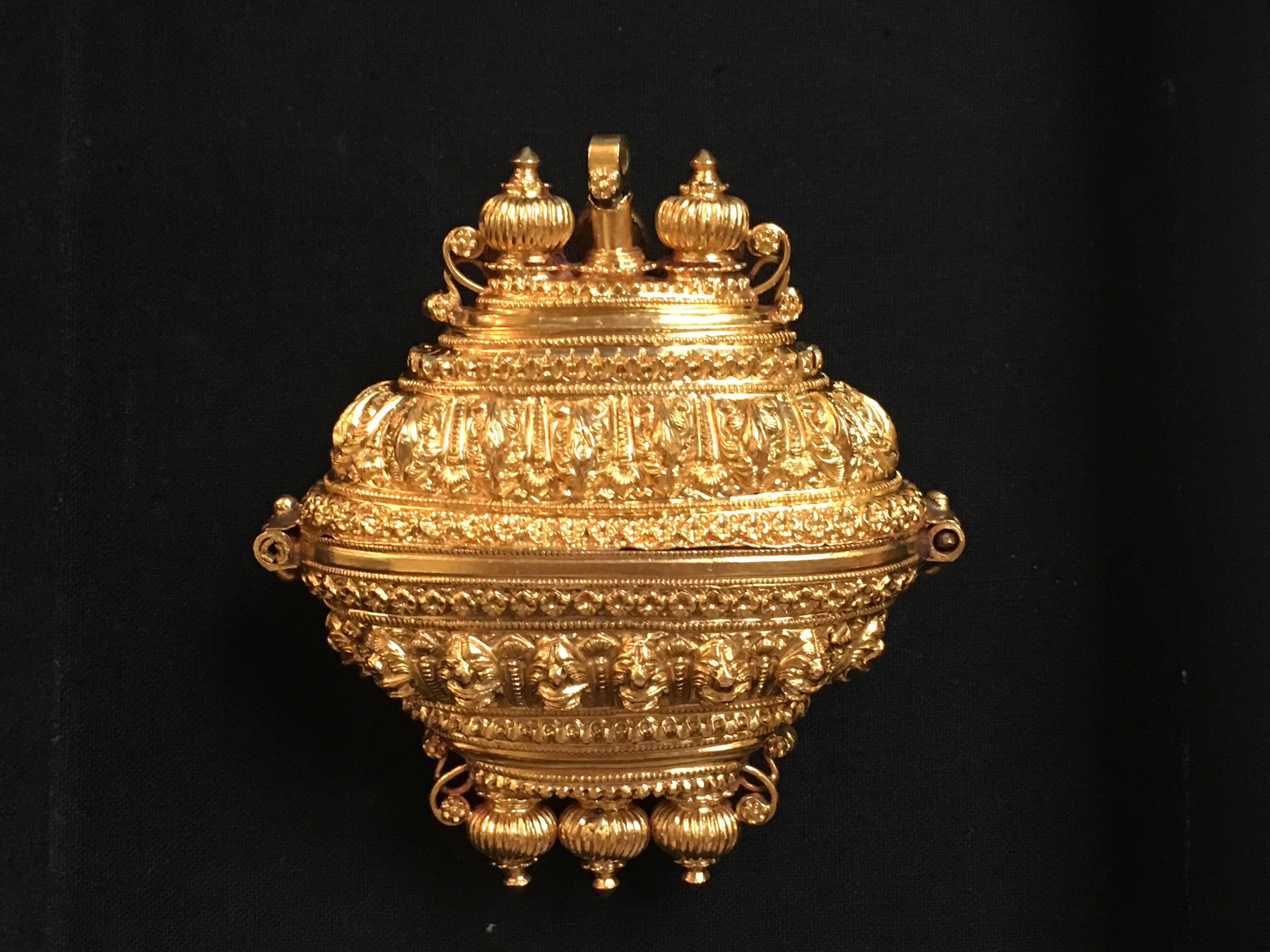 A stunning Indian lingam amulet box from a gowrisankara necklace, Tamil Nadu, late 19th century. This amulet box would have been worn on a necklace of rudraksha beads, and used by a Shaivite priest during holy festivals. A small holy lingam, or holy