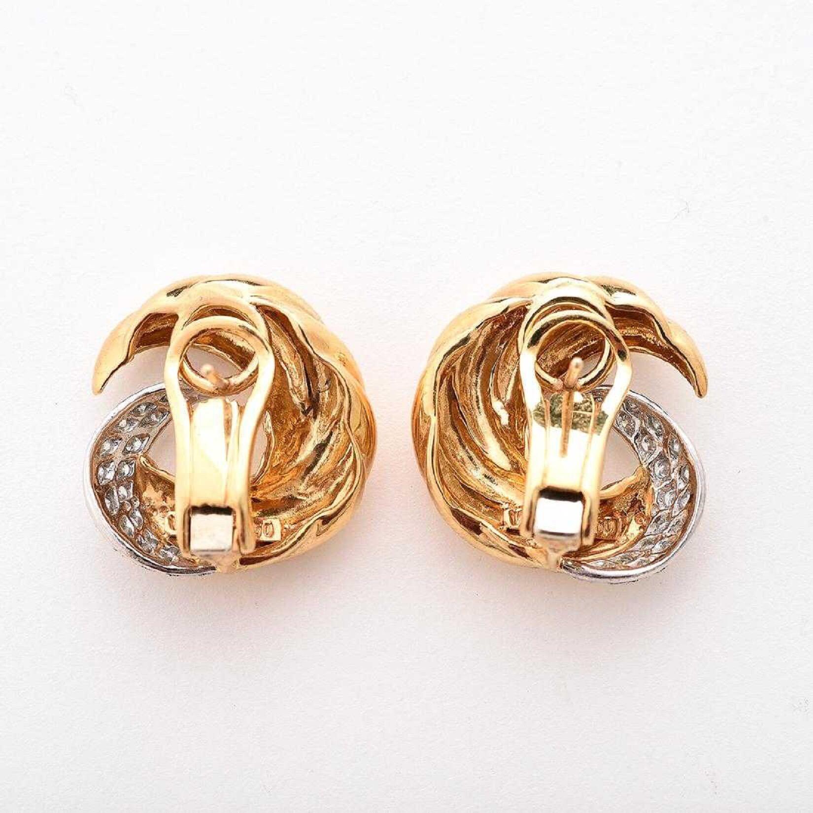 A beautiful and classic pair of Verdura 18k yellow gold and platinum set diamond clip earrings. 

The total diamond weight is 1.0 carats.  
The total earring weight is 24.1 grams.  
The earring measure 25 x 23 mm.  
Signed 