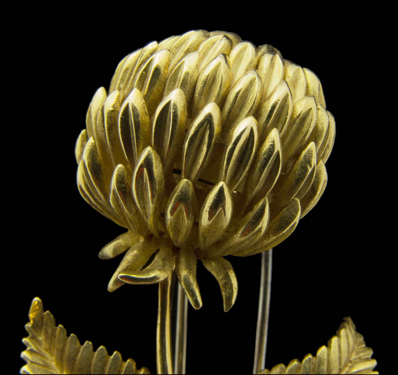 A charming 18k gold brooch in the form of a thistle. Marked Hermes Paris, etched serial number 47117. French hallmarks.